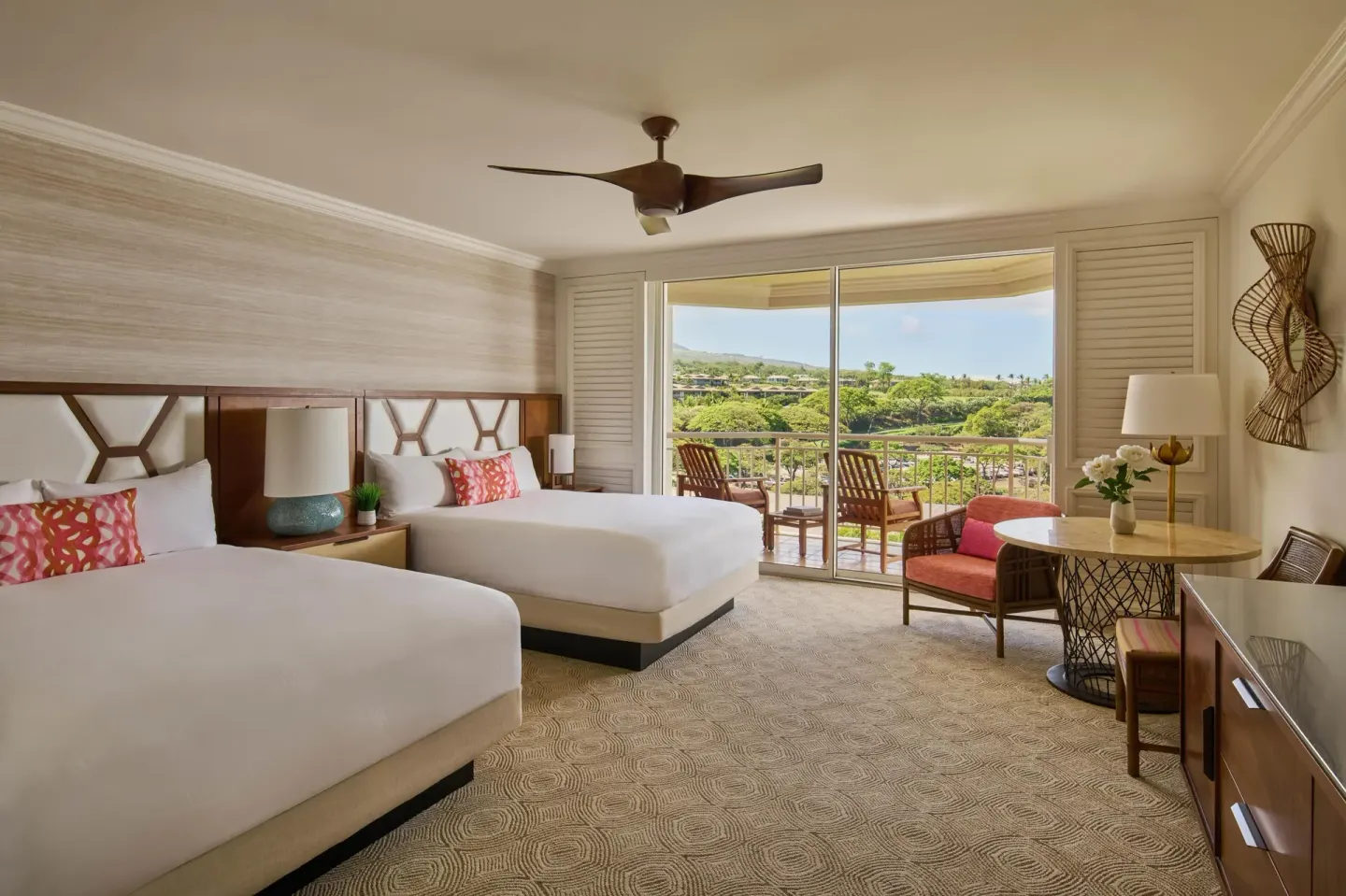 Terrace-view room with two beds and balcony seating at Grand Wailea Maui.