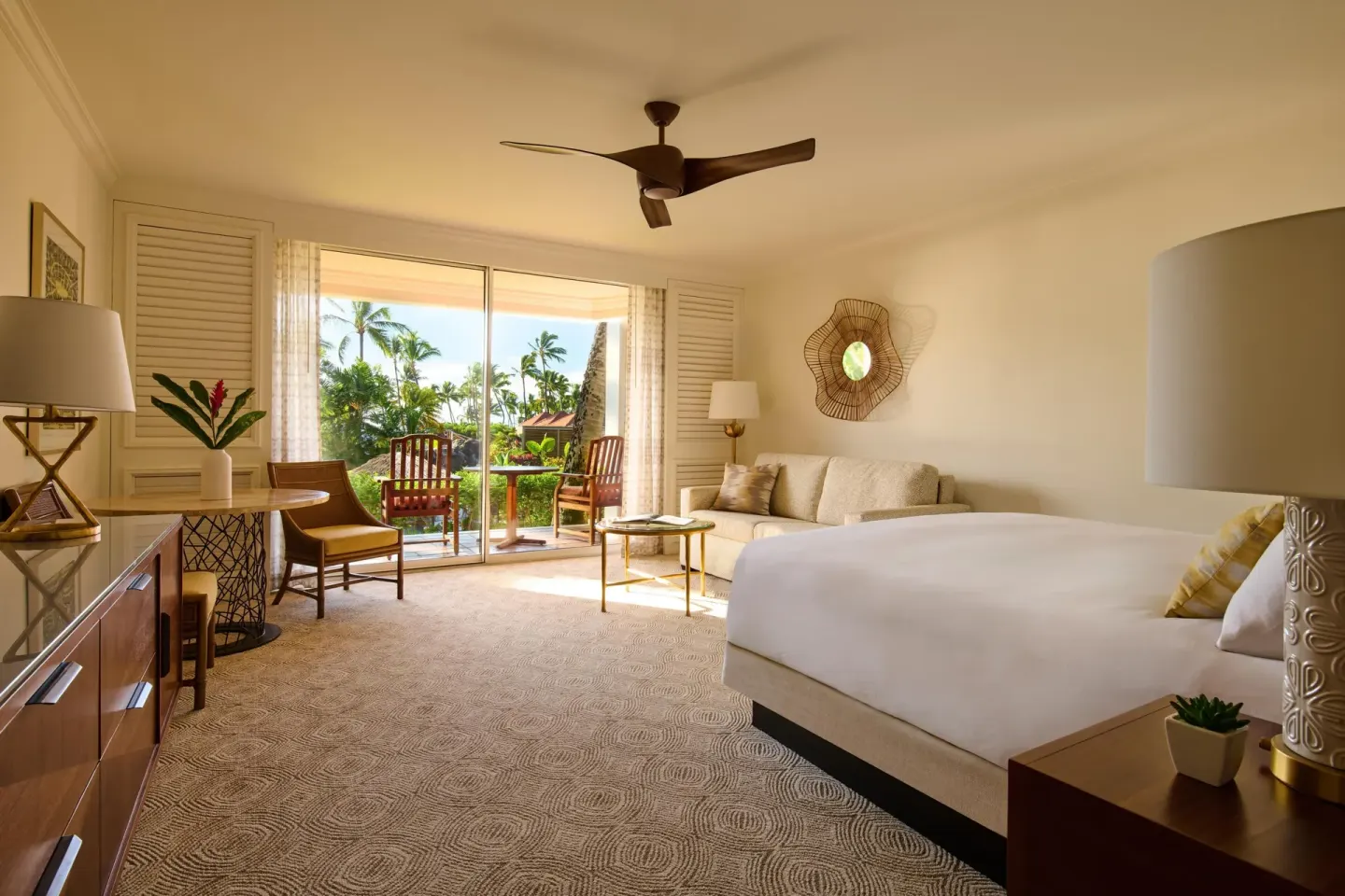 Garden view ground-floor king room with sofa bed and lanai at Grand Wailea Maui.