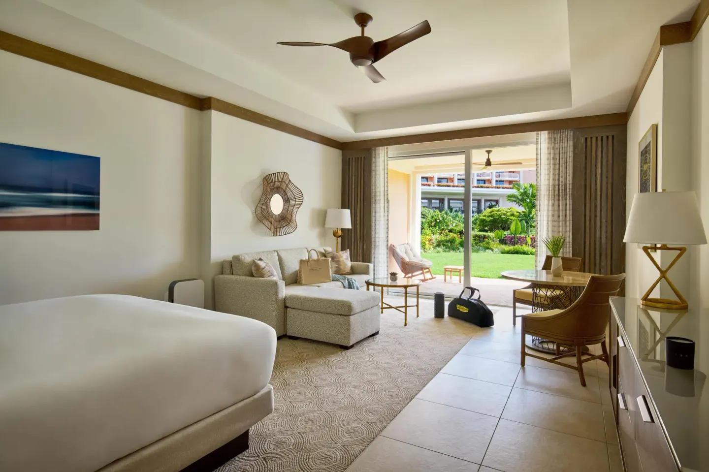 Garden-view wellness guest room with king bed and sofa bed at Grand Wailea Maui.