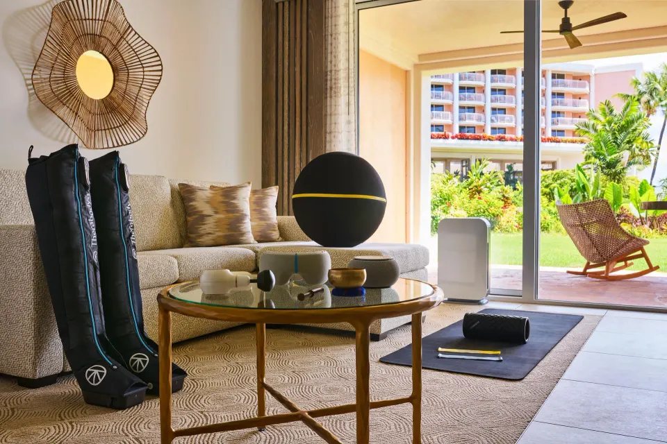 Wellness room sitting area with sofa bed and fitness gear at Grand Wailea Maui.