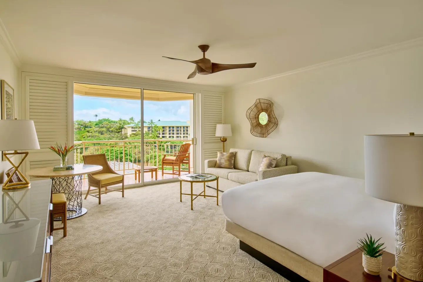 Terrace-view guest room with king bed and sofa bed at Grand Wailea Maui.