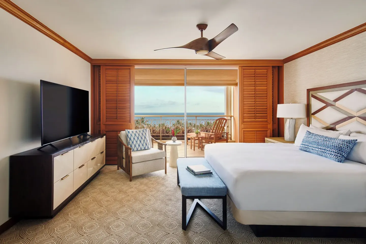 Royal Suite ocean-view bedroom with king bed and balcony at Grand Wailea Maui.