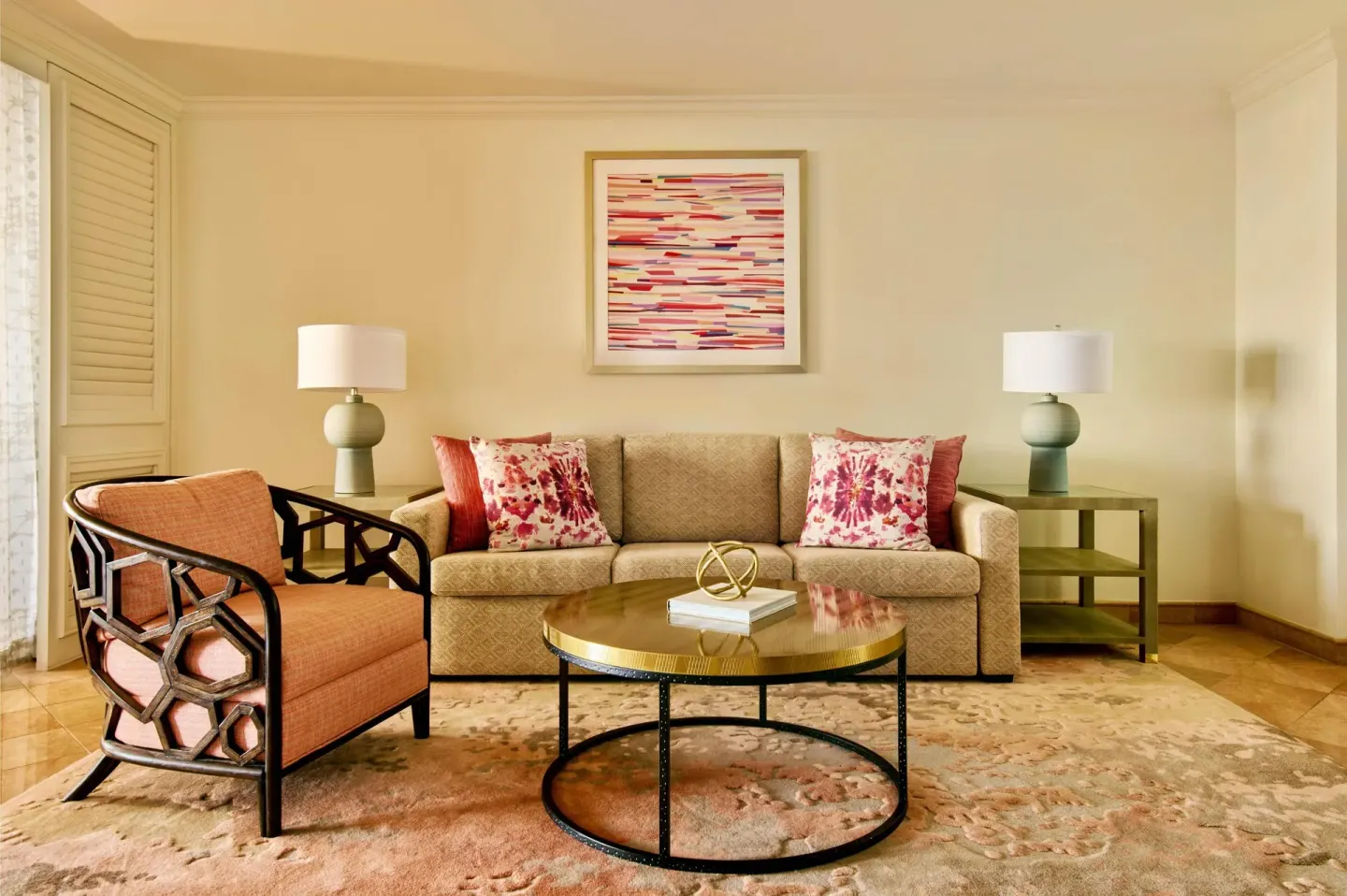 Suite living room seating at Grand Wailea Maui with sofa, armchair, lamps, and coffee table.