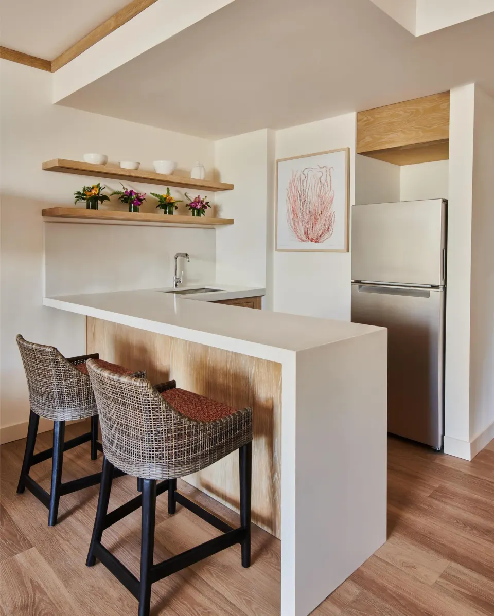 Suite kitchenette with bar stools and refrigerator at Grand Wailea Maui.