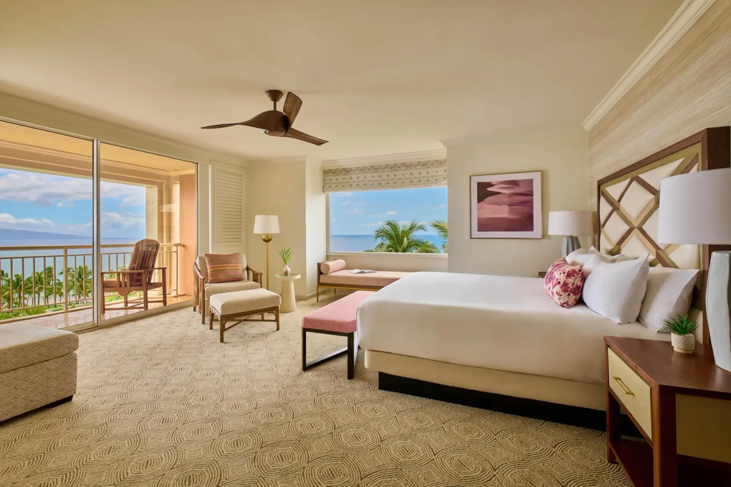 Ocean view one-bedroom suite with king bed and balcony at Grand Wailea Maui.