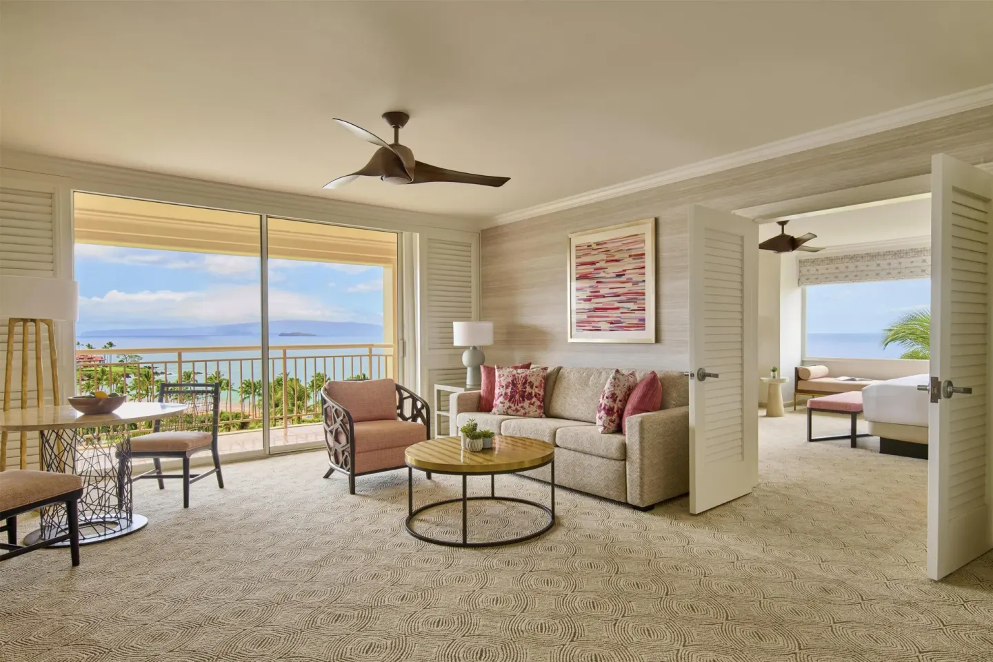 Ocean view suite living room with balcony and bedroom beyond at Grand Wailea Maui.