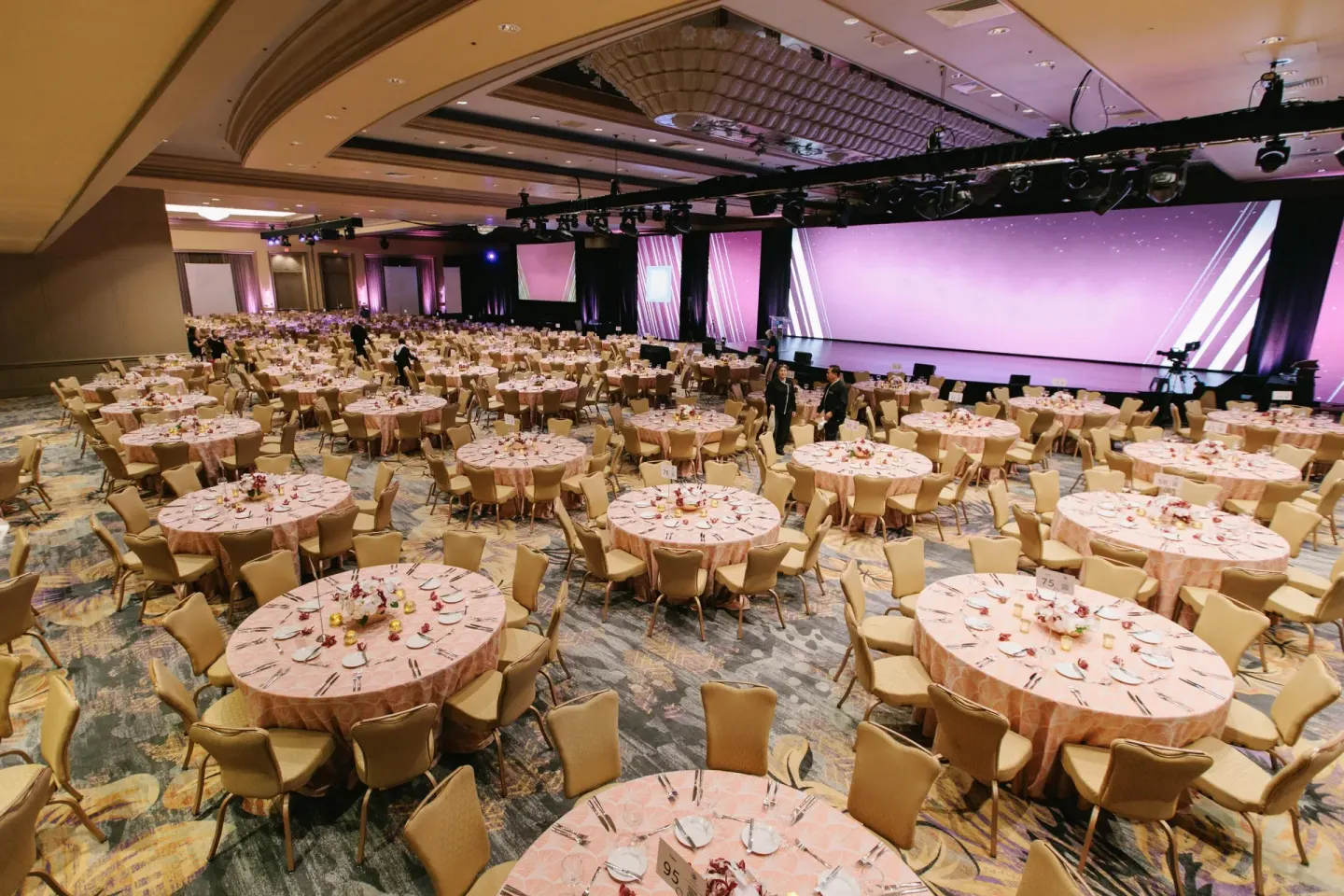 Large ballroom banquet with stage and round tables at Grand Wailea Maui.