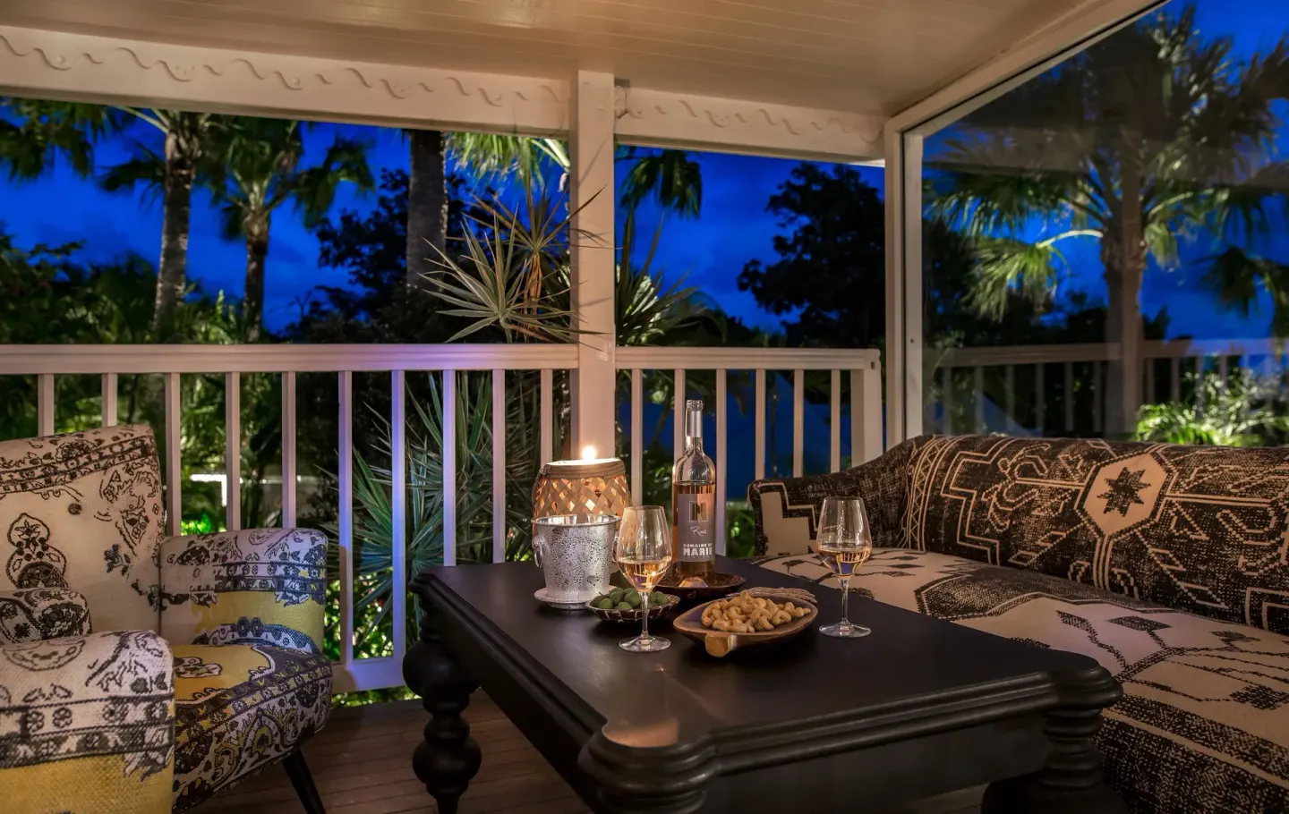 Candlelit terrace seating with wine and snacks at GYP SEA Saint Barth.