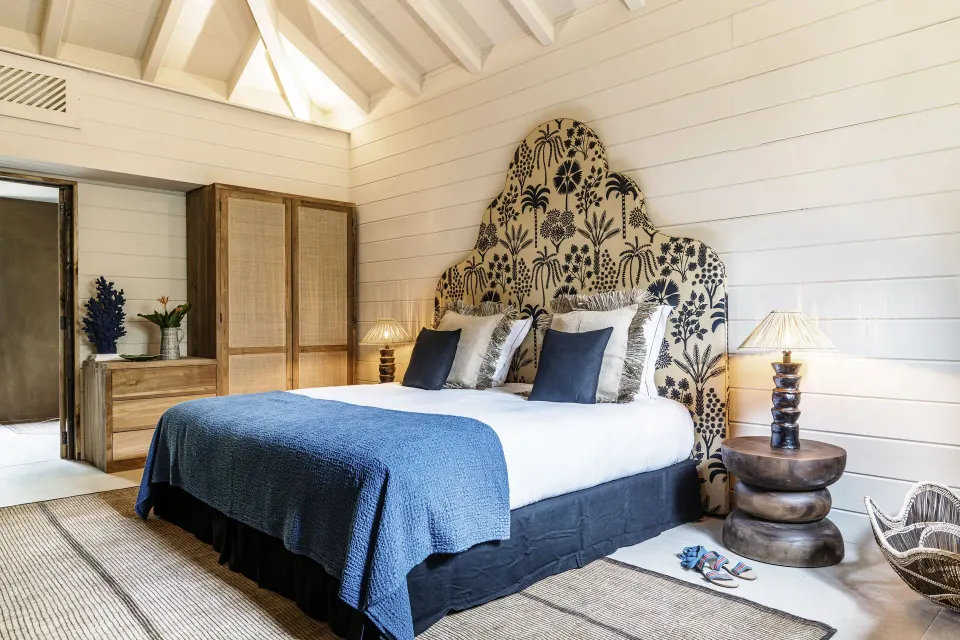 Bohemian Blue Beach House bedroom with king bed and patterned headboard at GYP SEA Saint Barth.