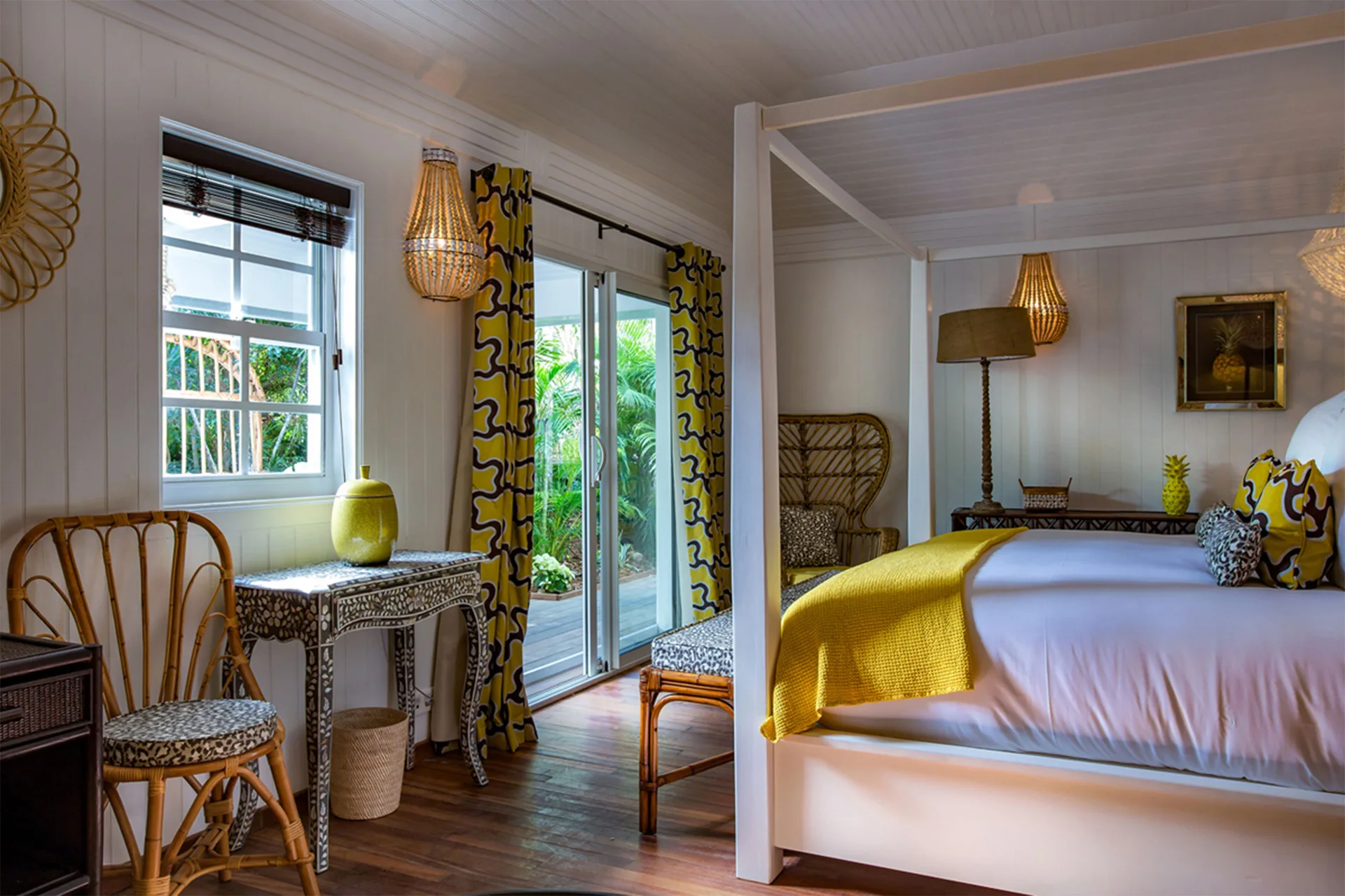 Bungalow Plantation bedroom with canopy bed and garden doors at GYP SEA Saint Barth.
