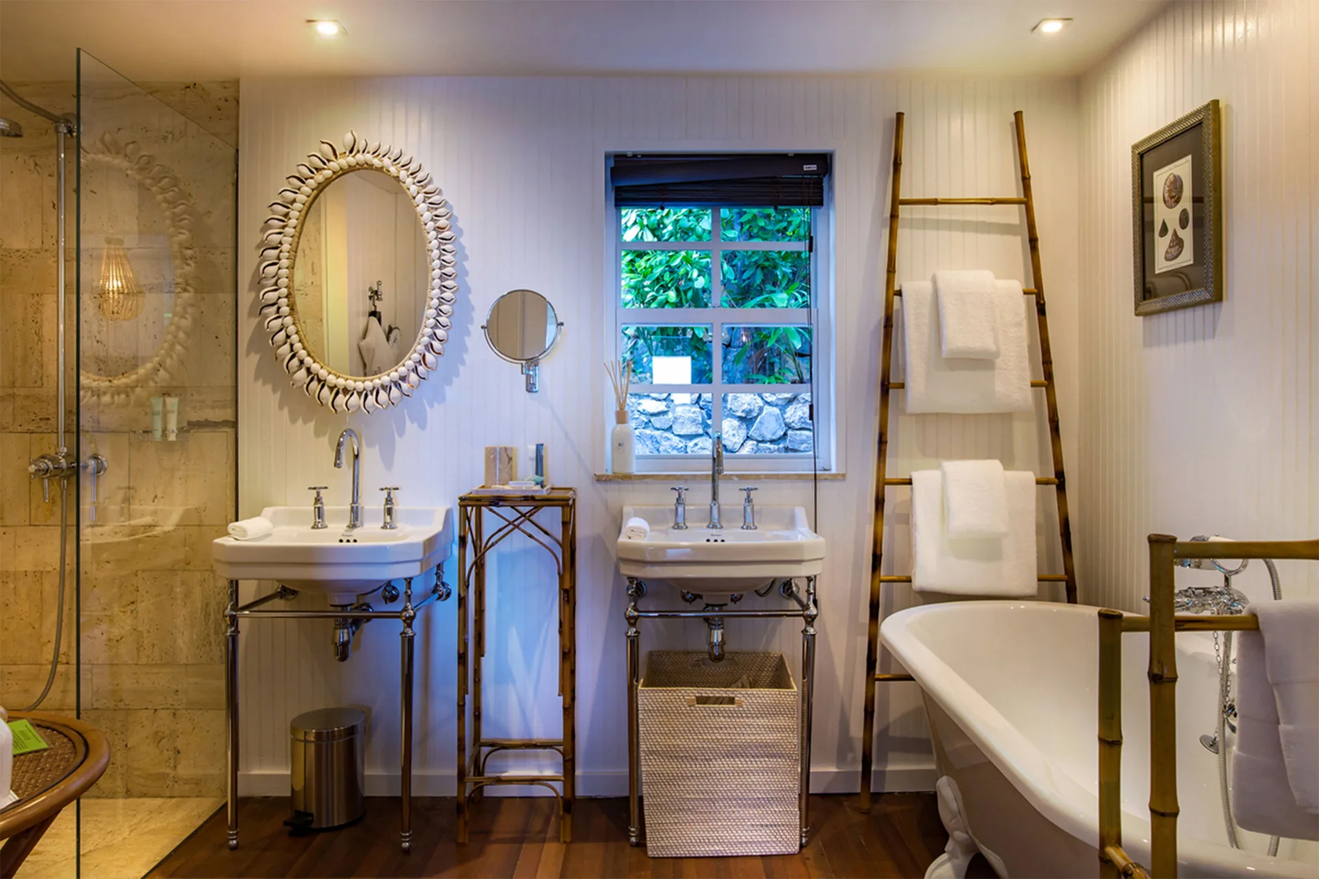Prestige Caribbean Bungalow bathroom with double sinks and bathtub at GYP SEA Saint Barth.
