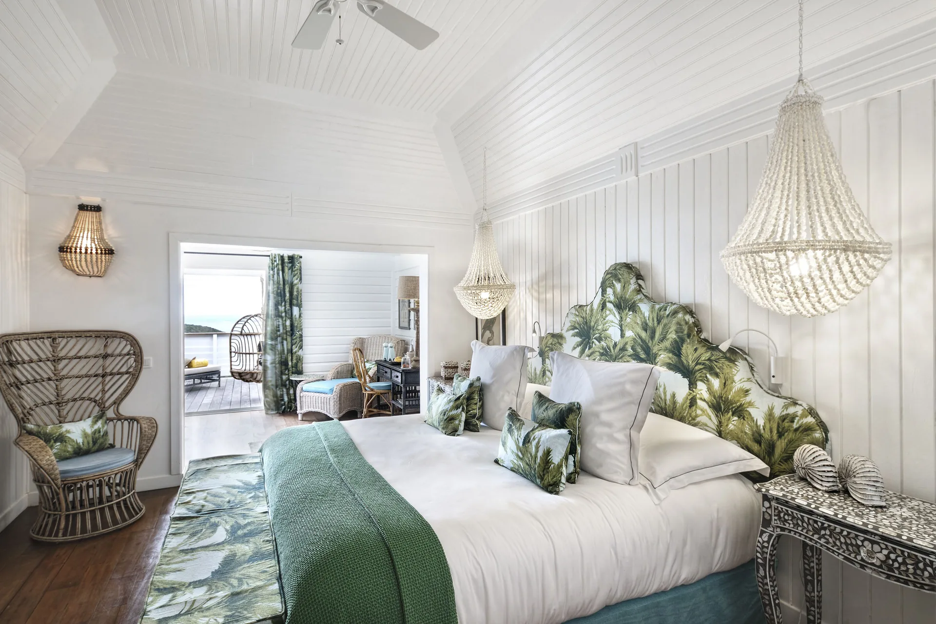 Prestige Caribbean Bungalow bedroom with king bed and palm accents at GYP SEA Saint Barth.