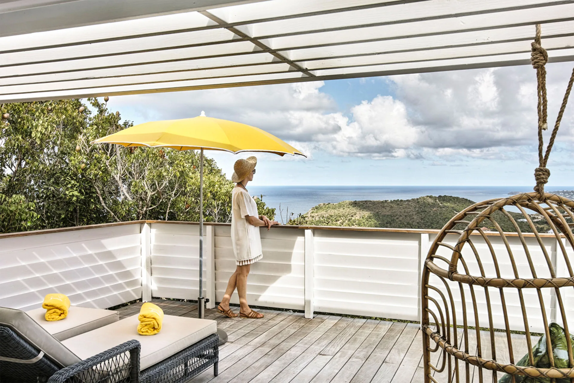 Prestige Caribbean Bungalow terrace with loungers, yellow umbrella and sea view at GYP SEA Saint Barth.