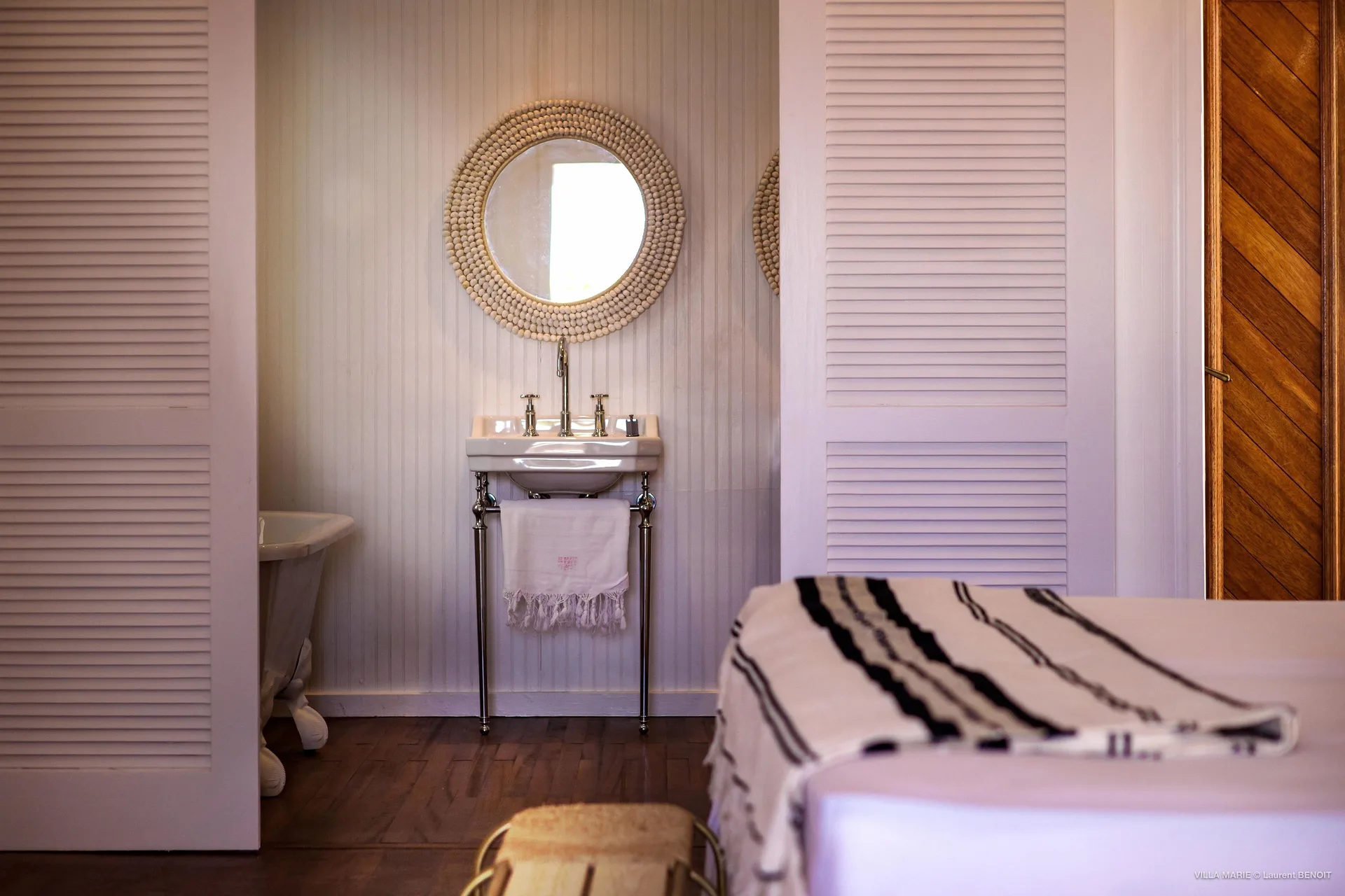 Family Suite bathroom vanity and bed at GYP SEA Saint Barth.