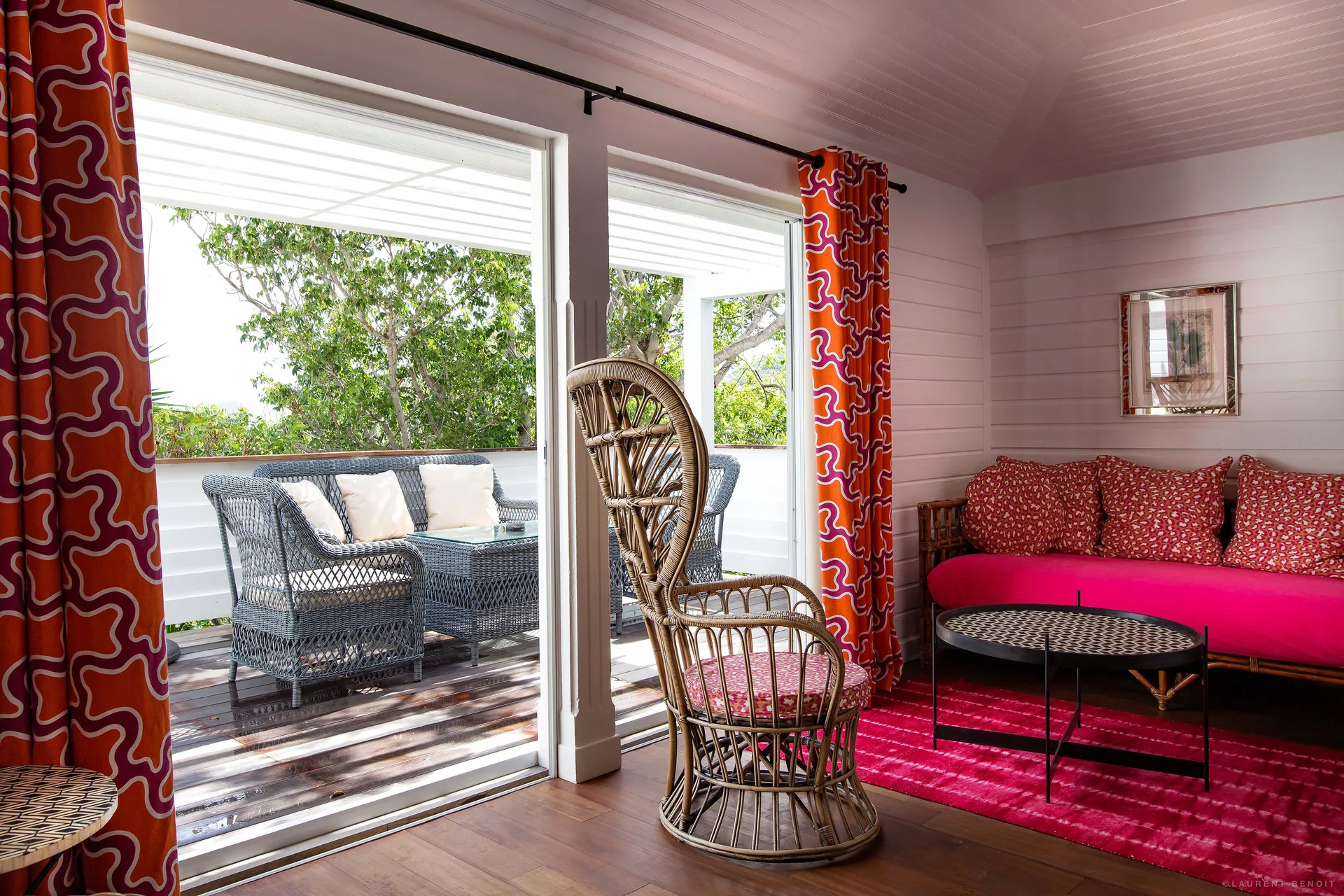 Family Suite lounge opening to a furnished terrace at GYP SEA Saint Barth.