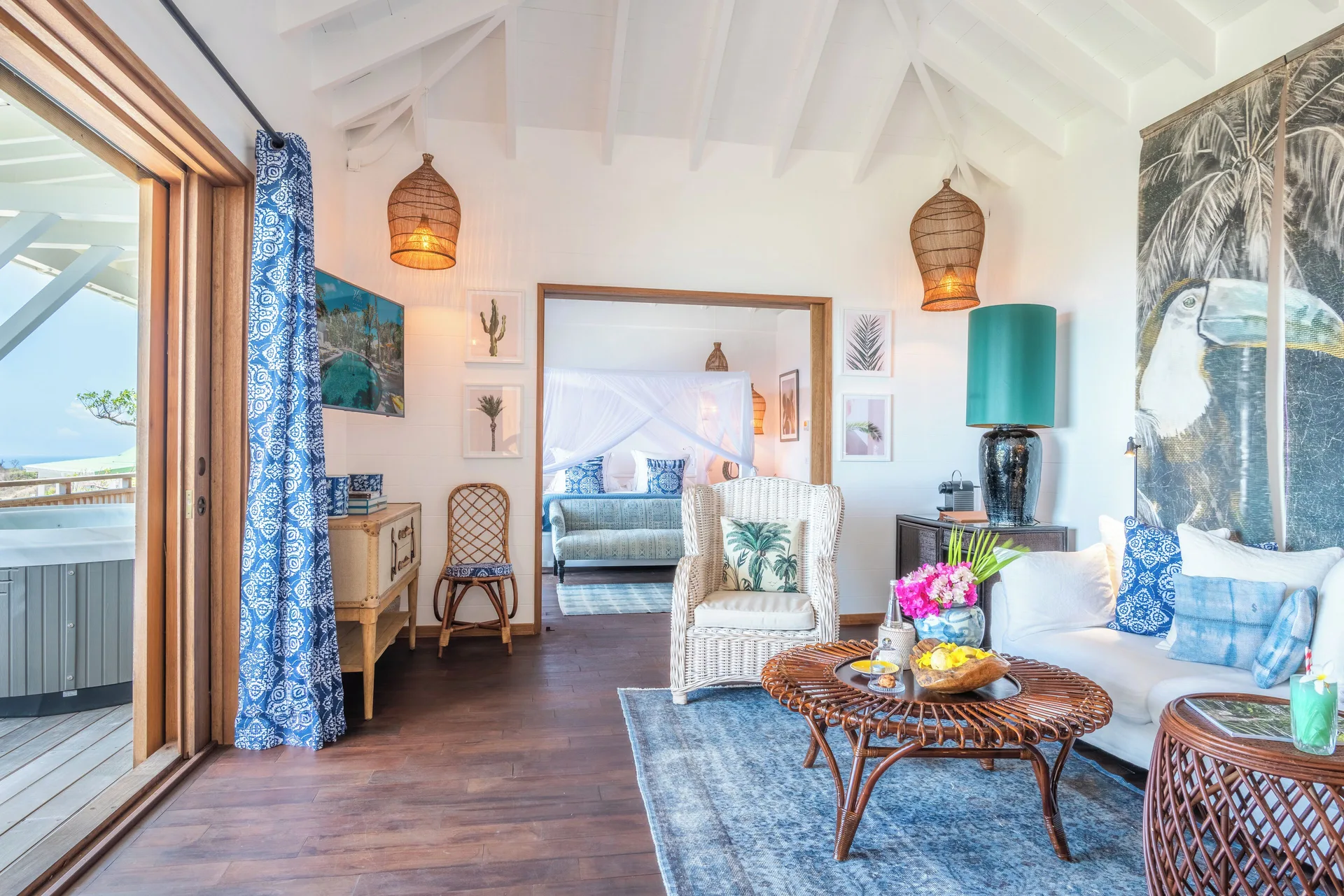 Havana Suite living area opening to the bedroom and balcony at GYP SEA Saint Barth.