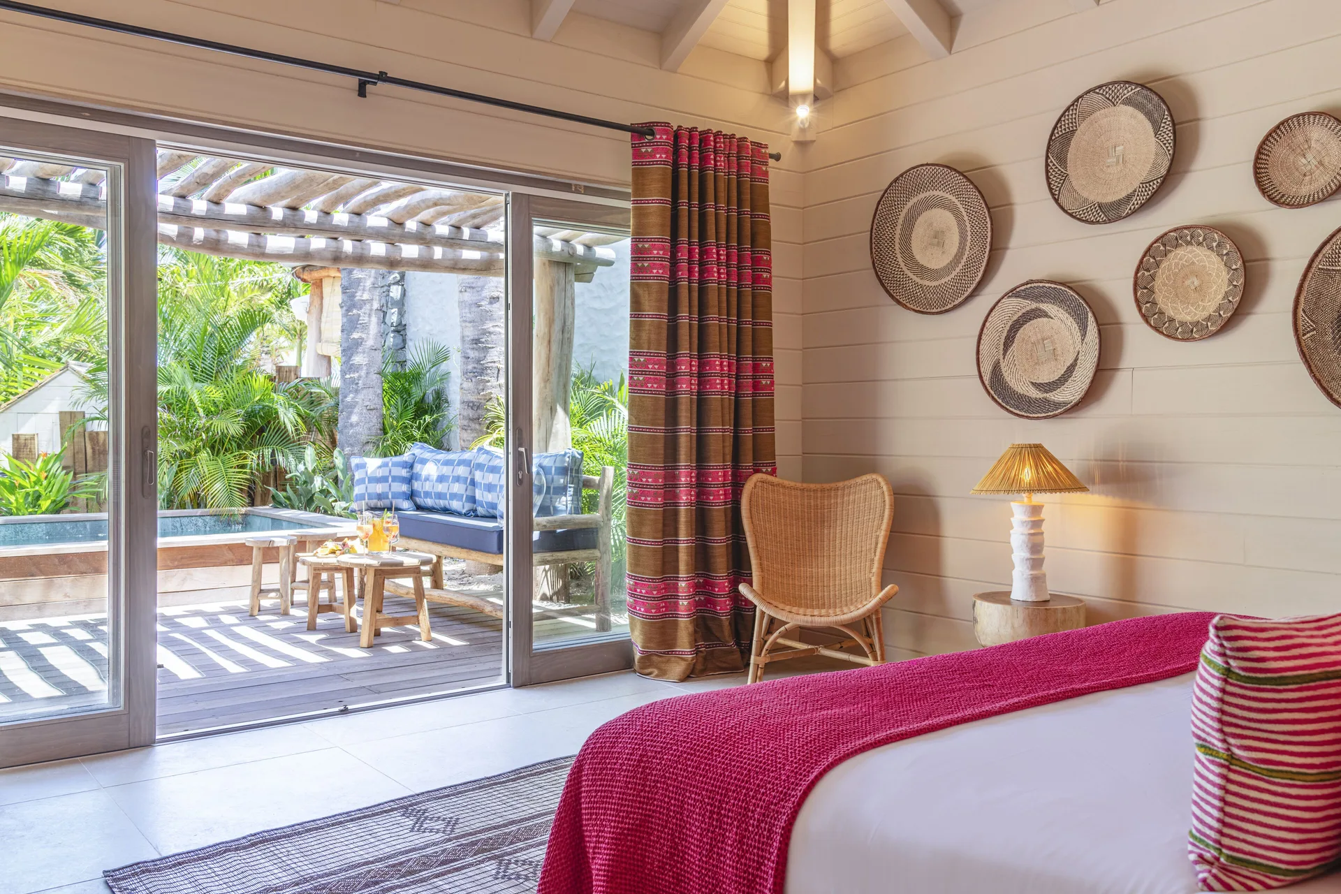 Guest room with terrace seating and pool at GYP SEA Saint Barth.