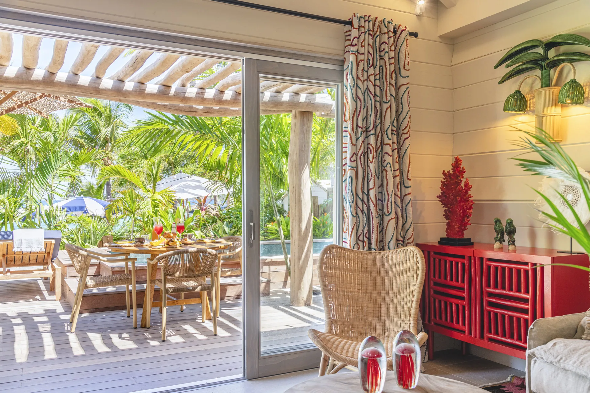 Indoor sitting area opening to the terrace at GYP SEA Saint Barth.