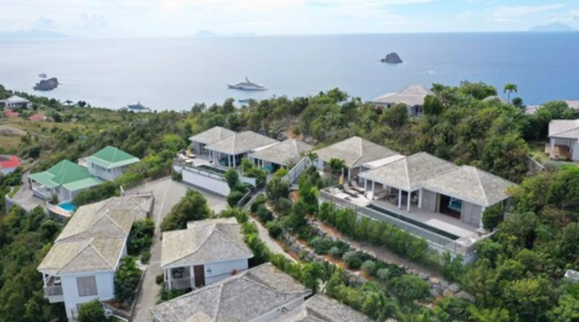 Aerial view of hillside villas and the sea at GYP SEA Saint Barth.
