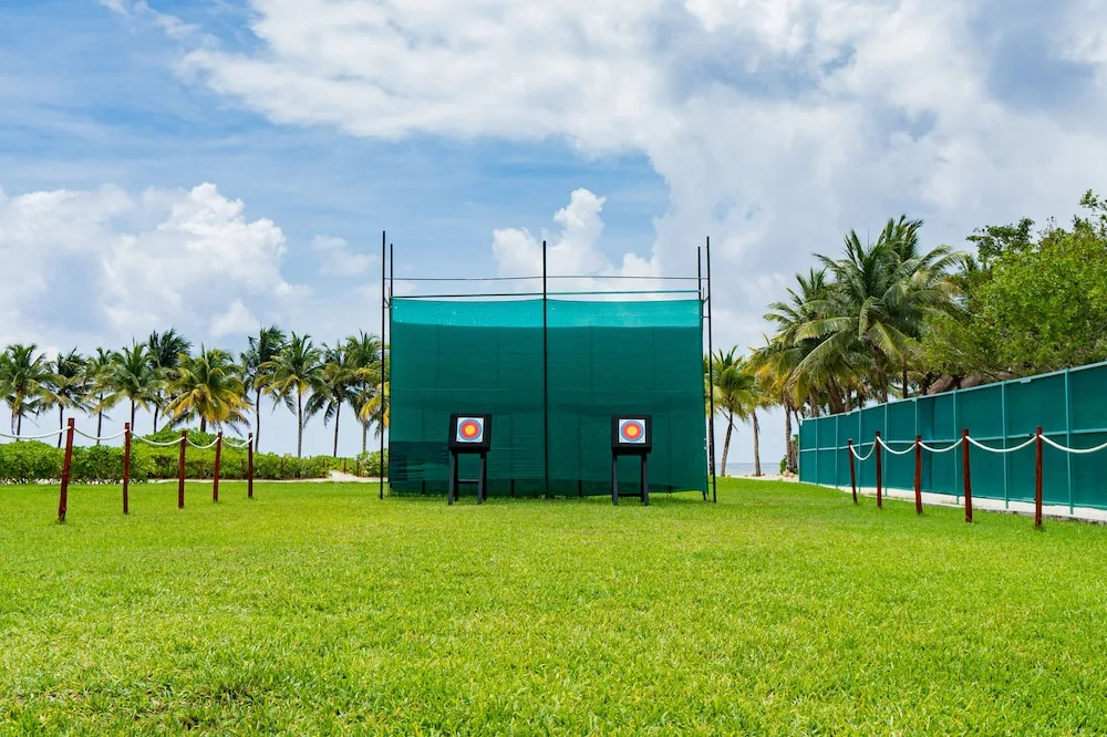 Archery targets on a grassy lawn at Hacienda Tres Rios Resort, Spa & Nature Park.
