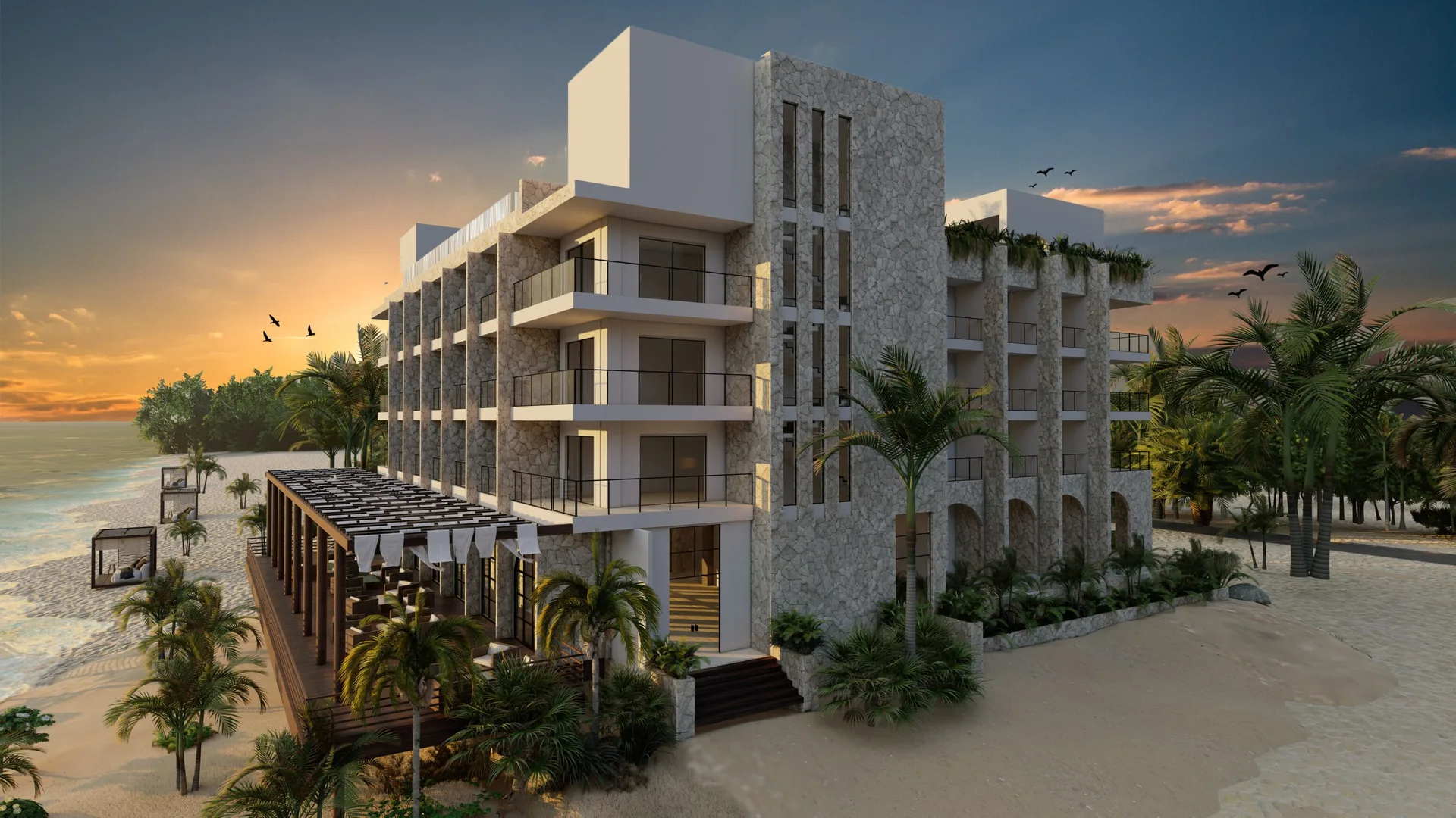 Beachfront resort building at sunset at Hacienda Tres Rios Resort, Spa & Nature Park.