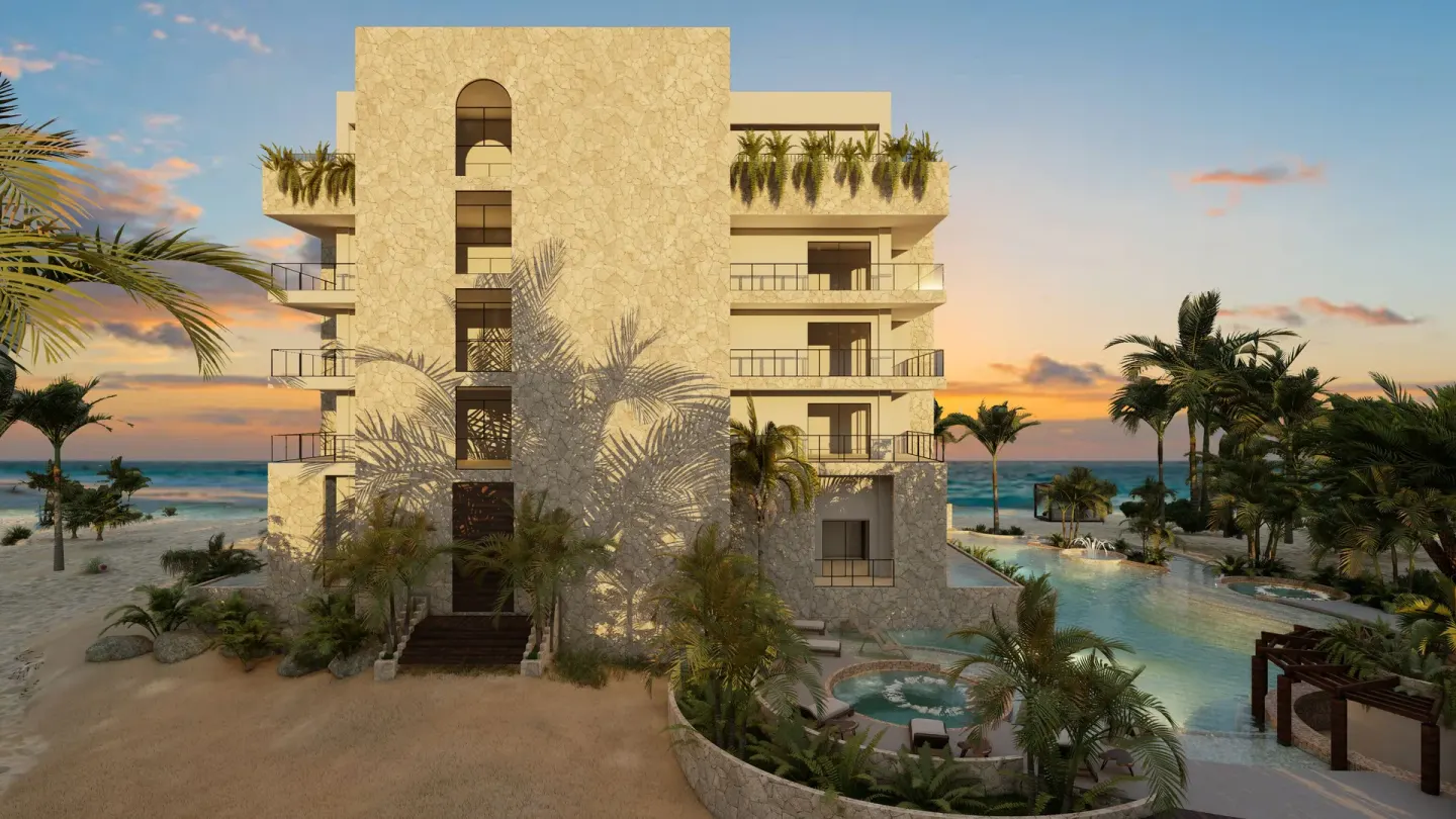 Resort building beside pools and palms at Hacienda Tres Rios Resort, Spa & Nature Park.