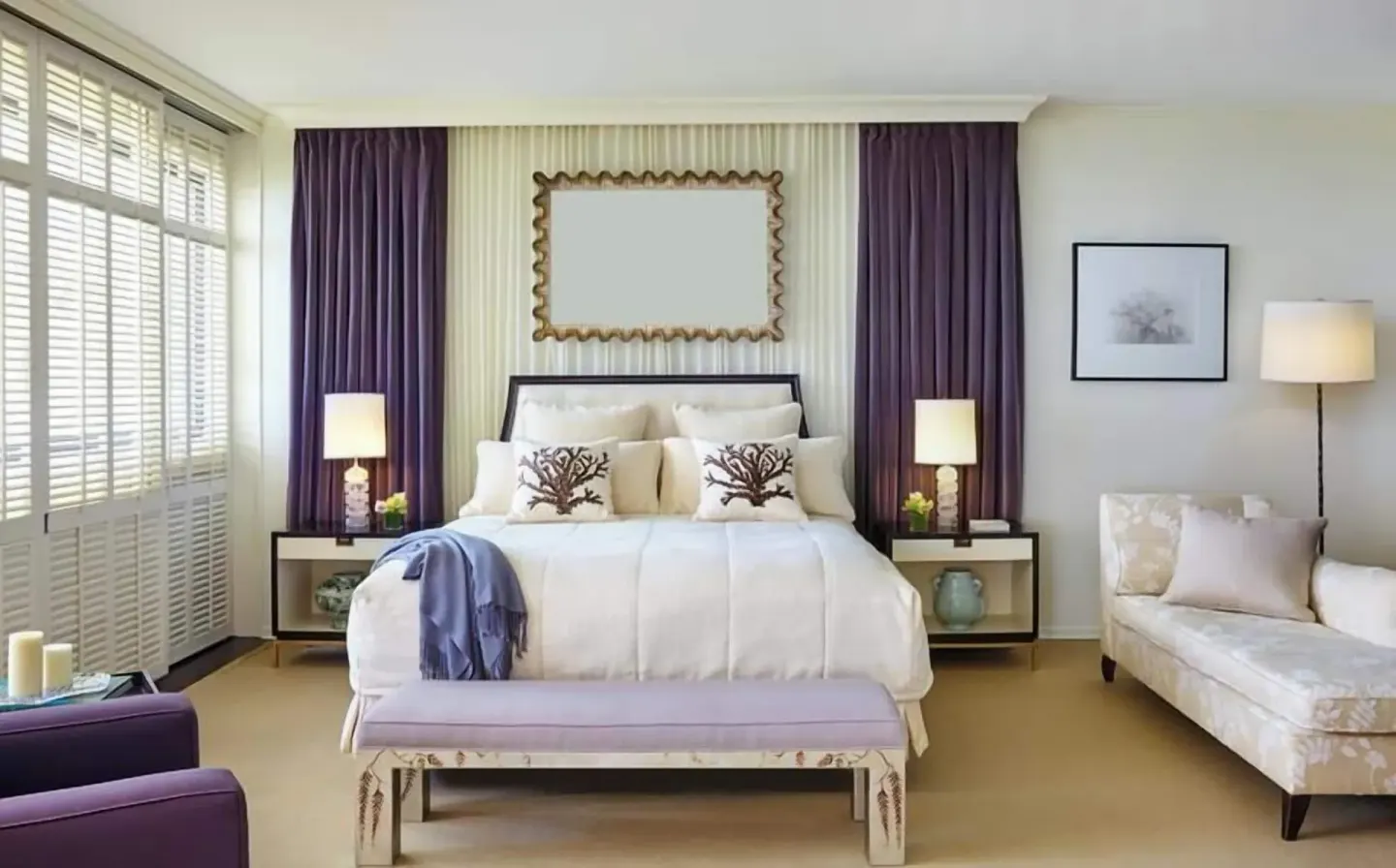 Guest room at Halekulani with a king bed, purple drapery, bench, and chaise lounge.
