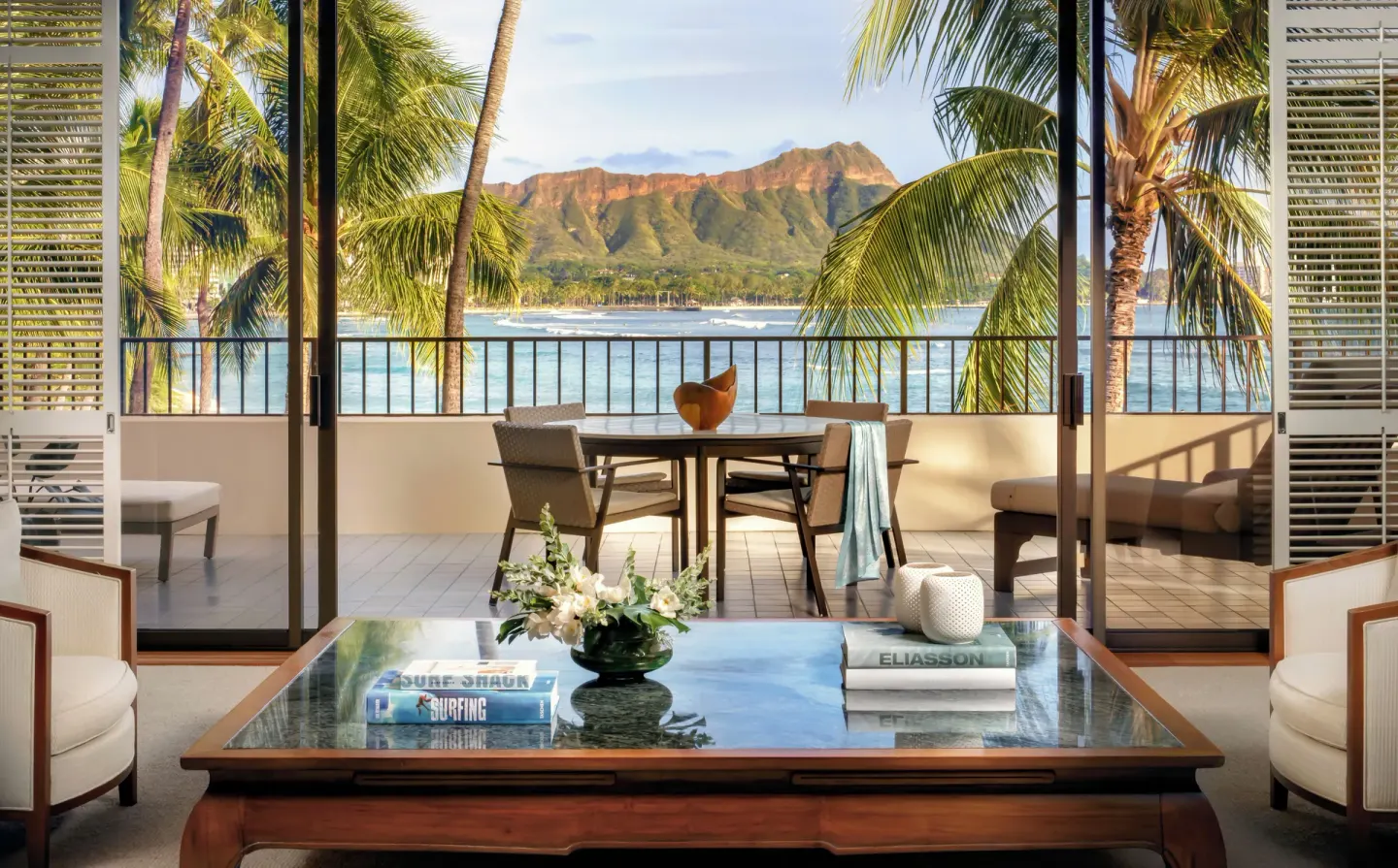 Living room and lanai with Diamond Head views at Halekulani.