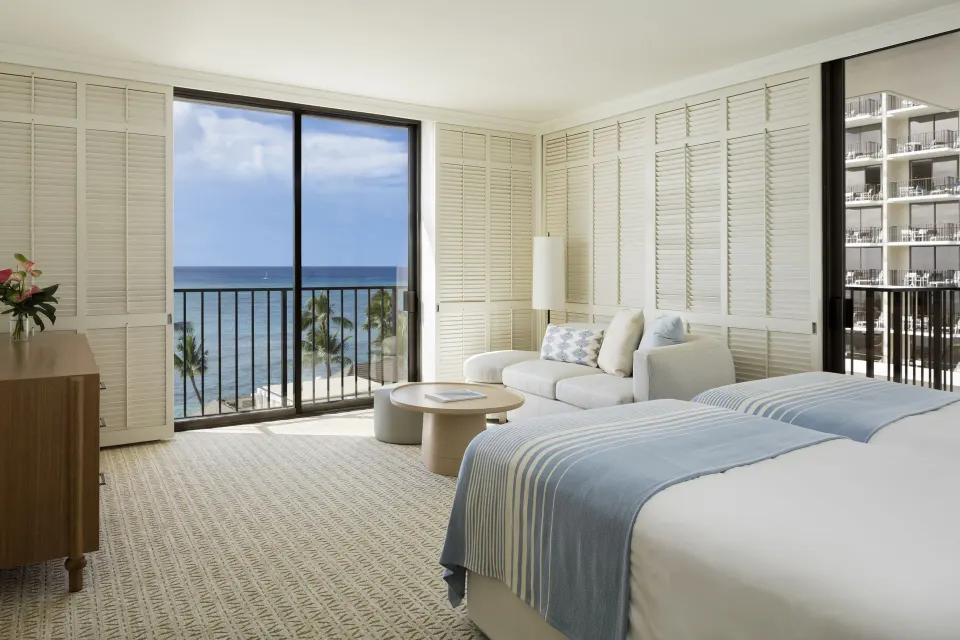 Junior Suite Ocean View with beds, sofa, balcony and ocean view at Halekulani.