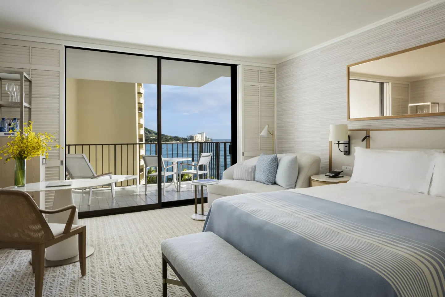 Ocean View room with king bed, balcony, and water view at Halekulani.