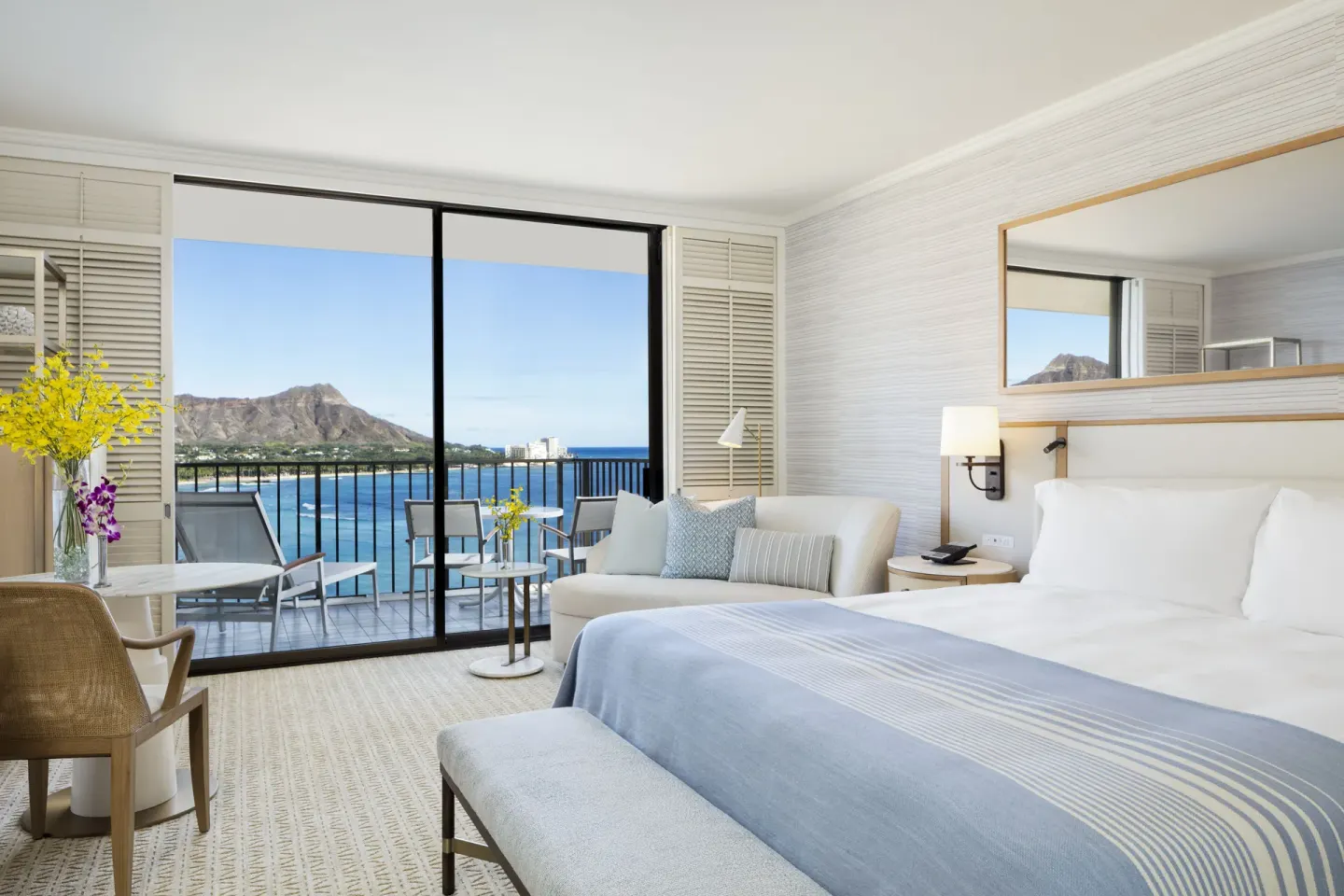 Oceanfront Diamond Head king room at Halekulani with balcony, seating, and ocean view.