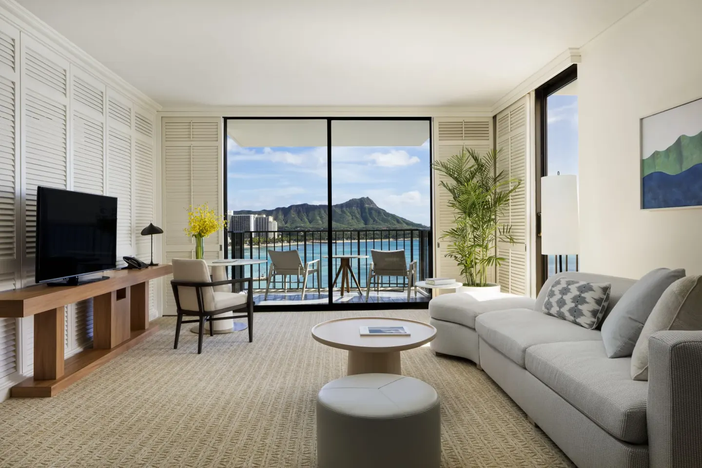 One-bedroom suite living room with Diamond Head view at Halekulani.