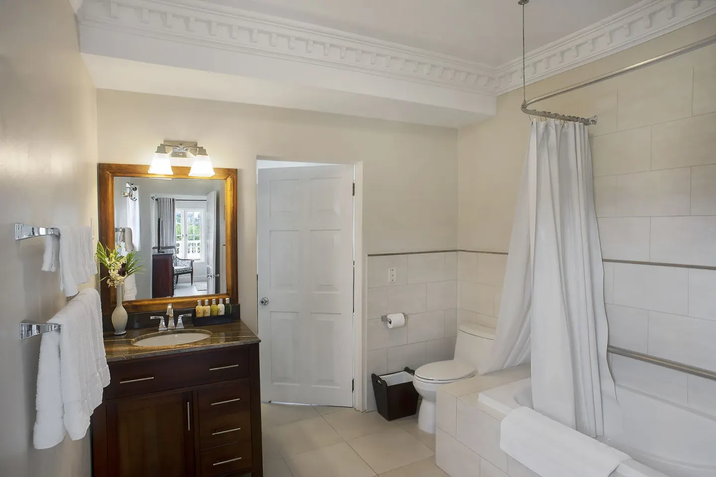 Bathroom vanity and curtained tub in a 5 Bedroom Ocean View Villa at Half Moon.