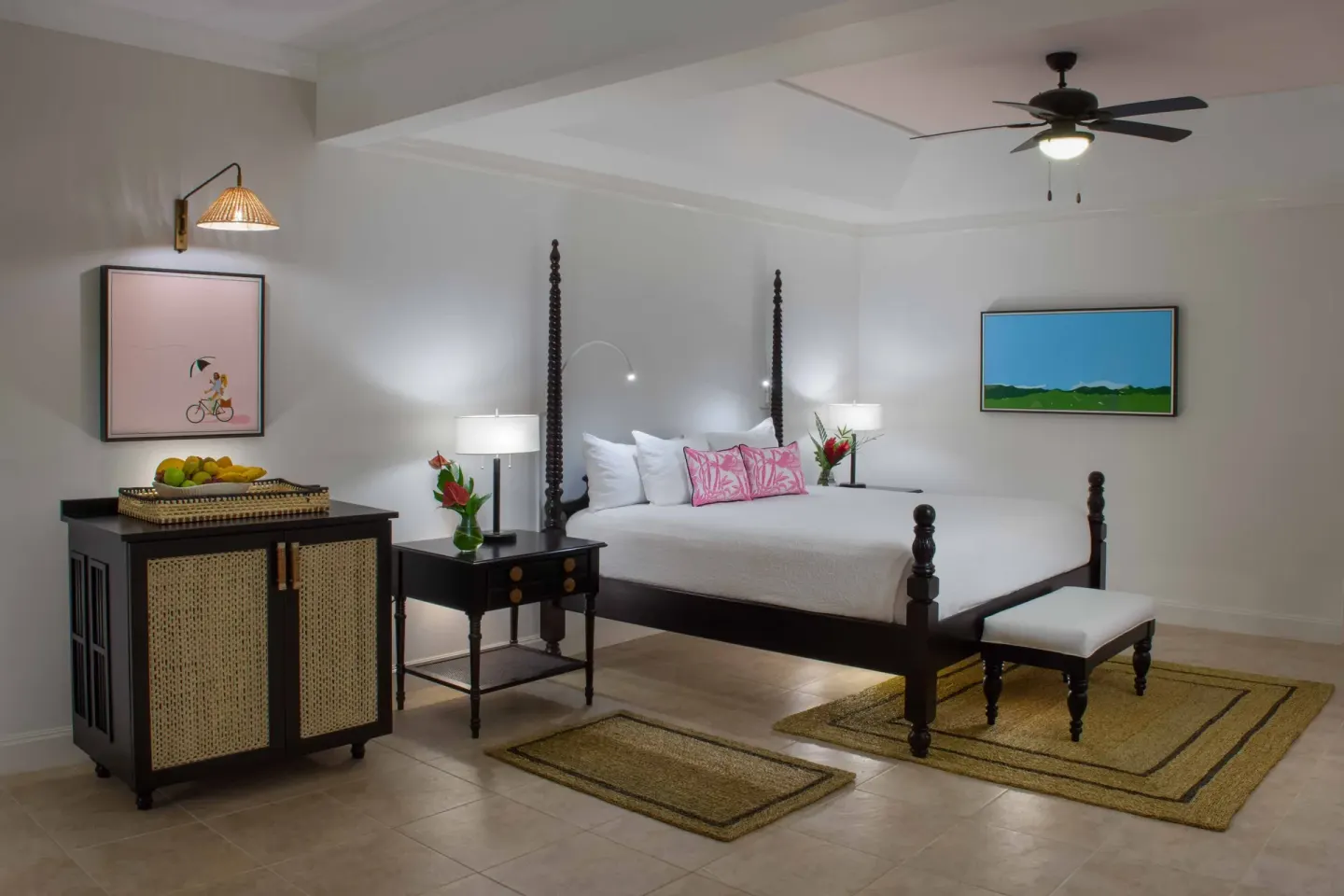 Junior Suite Ocean bedroom with four-poster bed and fruit cabinet at Half Moon.
