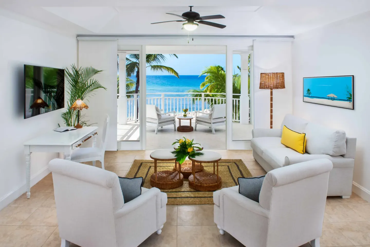 Junior Suite Ocean living room with terrace seating and ocean view at Half Moon.