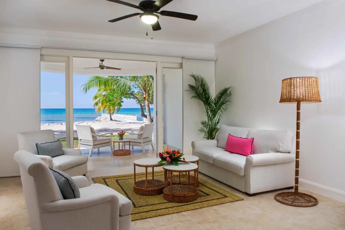 Junior Suite Ocean sitting area opening to a beach terrace at Half Moon.