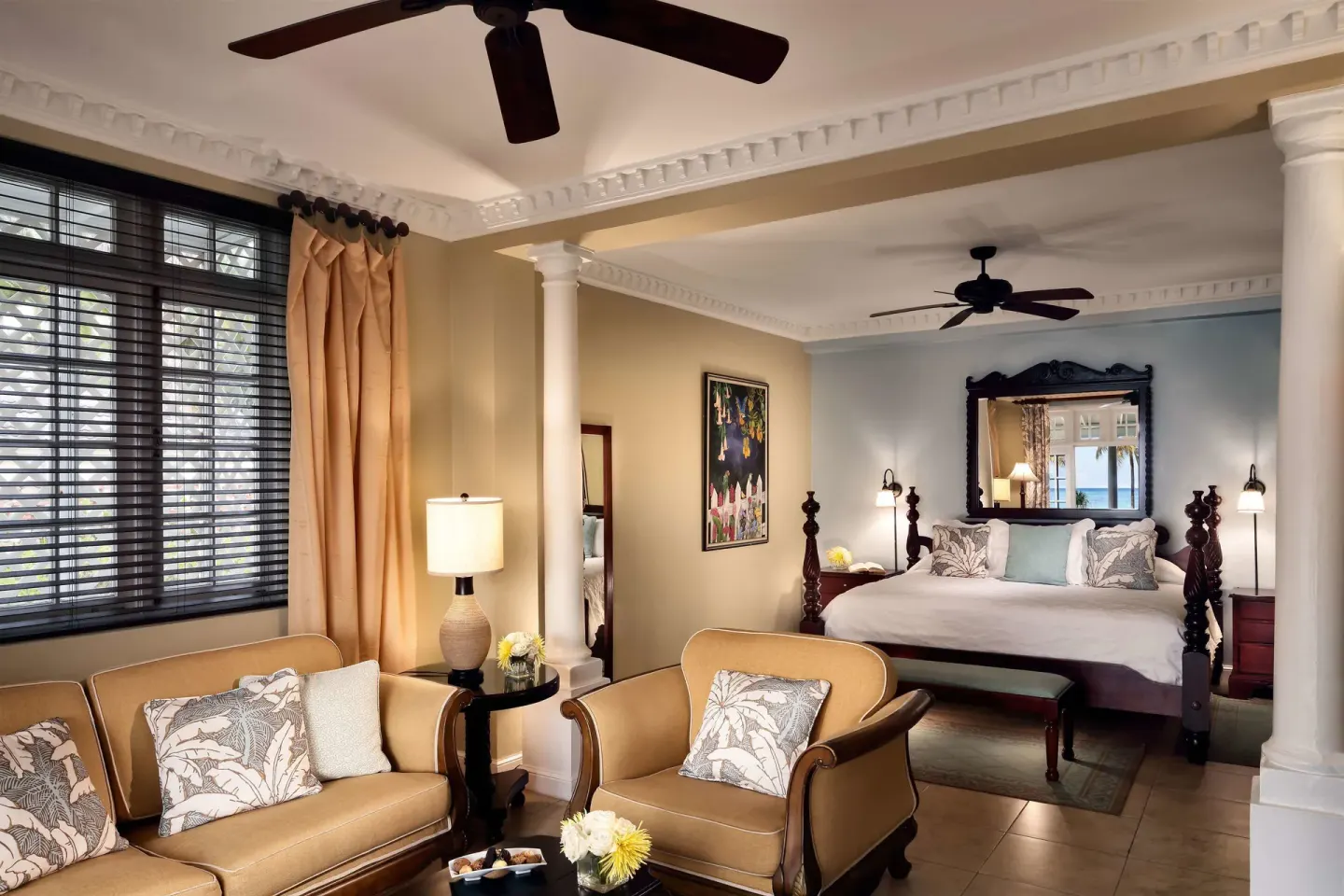 Junior Suite bedroom and sitting area with four-poster bed at Half Moon.