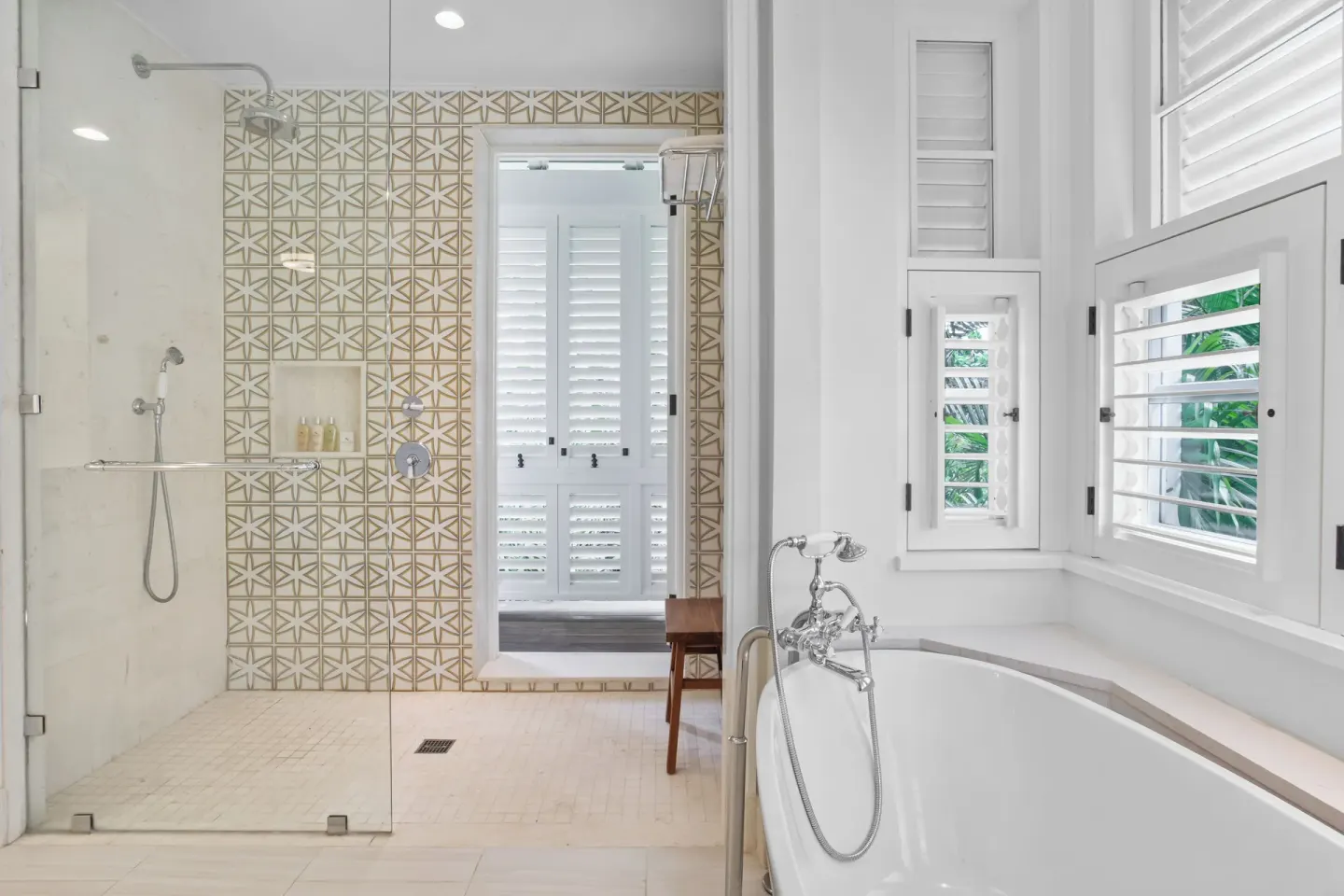 Estate Ocean bathroom with soaking tub and glass shower at Half Moon.