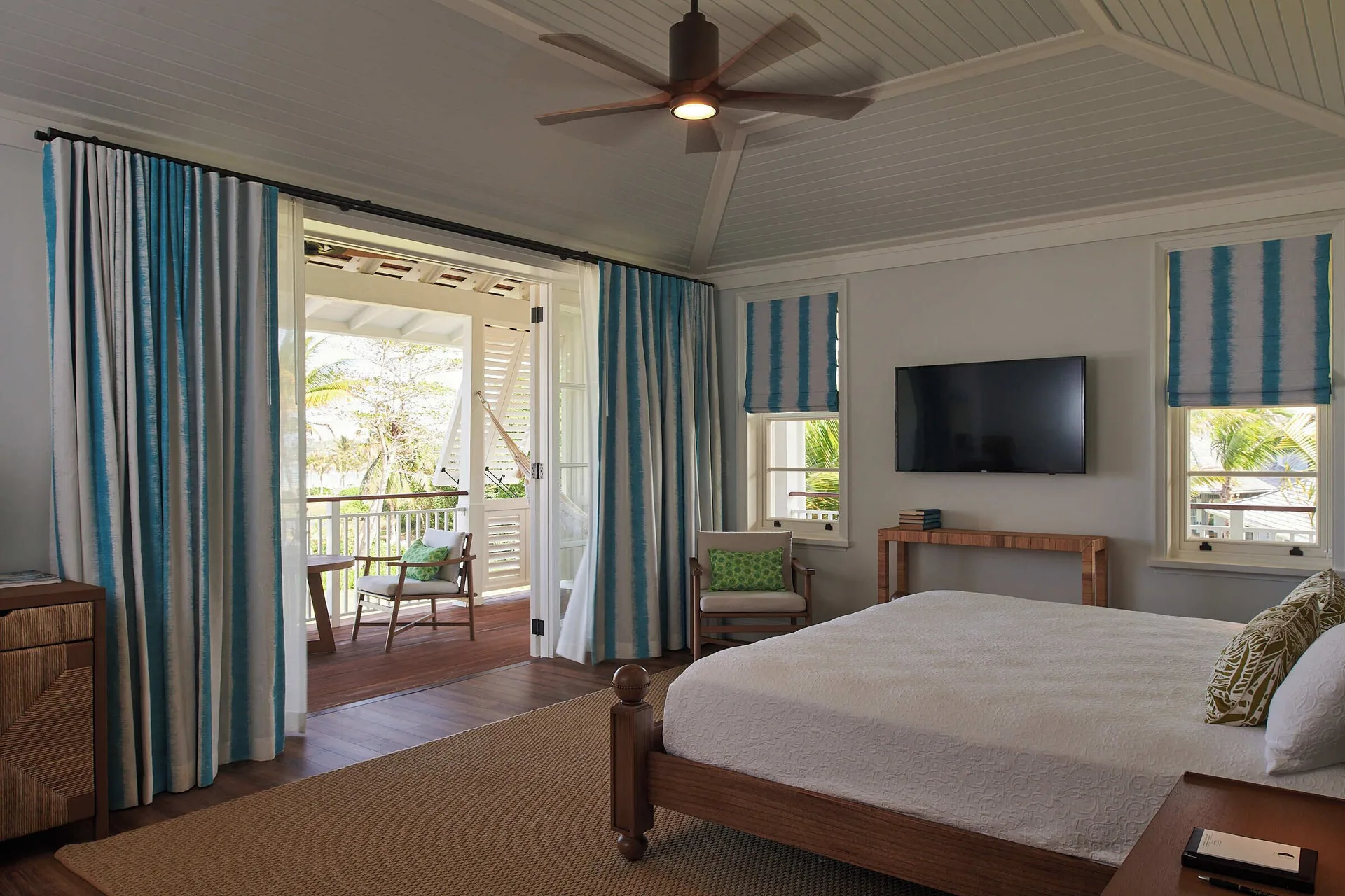 Estate Ocean guest room with king bed and balcony seating at Half Moon.