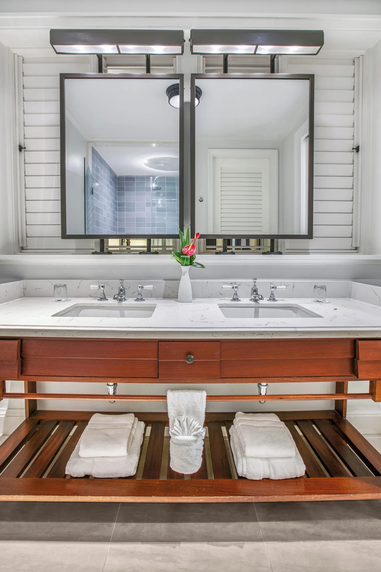 Great House Ocean bathroom vanity with twin sinks and mirrors at Half Moon.