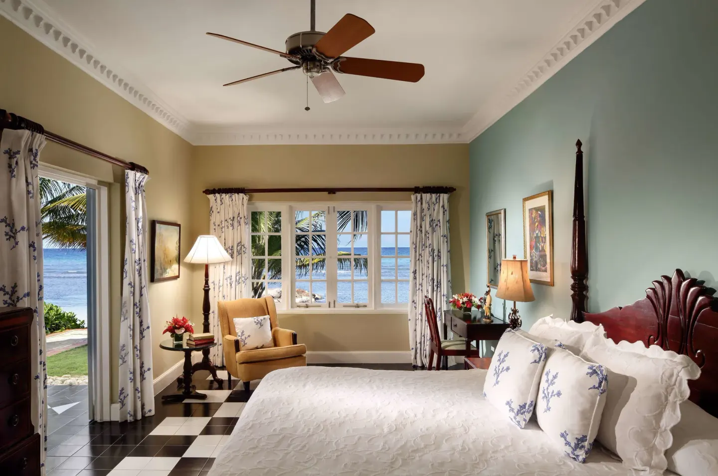 Ocean Suite bedroom with sea-facing windows and door at Half Moon.