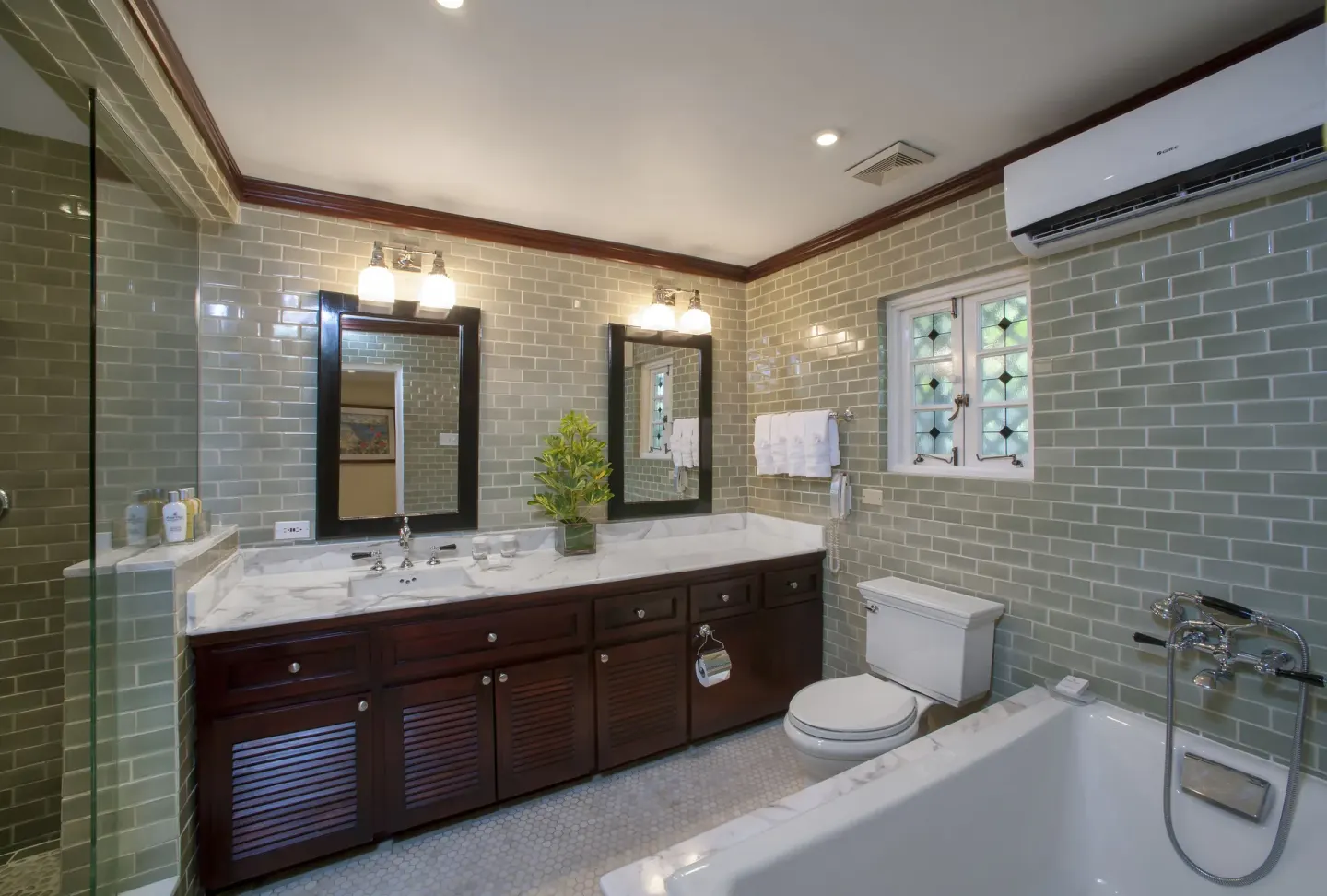 Ocean Prestige Suite bathroom with double vanity and bathtub at Half Moon.