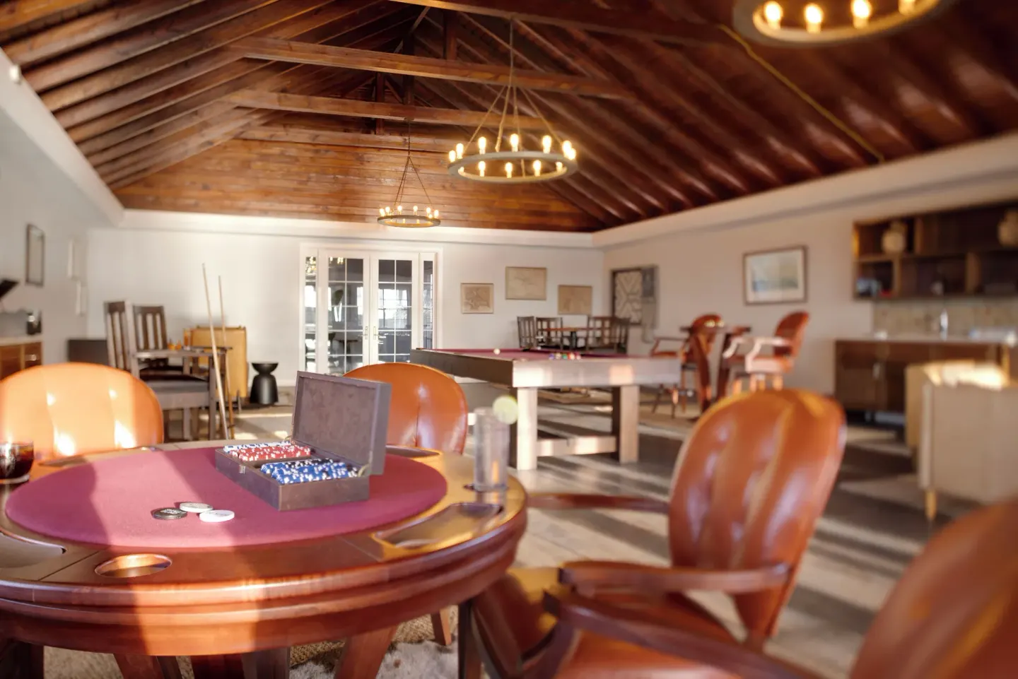 Game lounge with poker chips and a pool table at Hammock Cove Antigua.