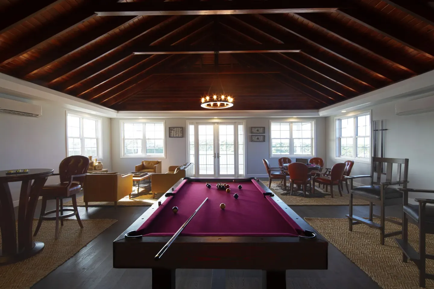 Pool table and seating in the game lounge at Hammock Cove Antigua.
