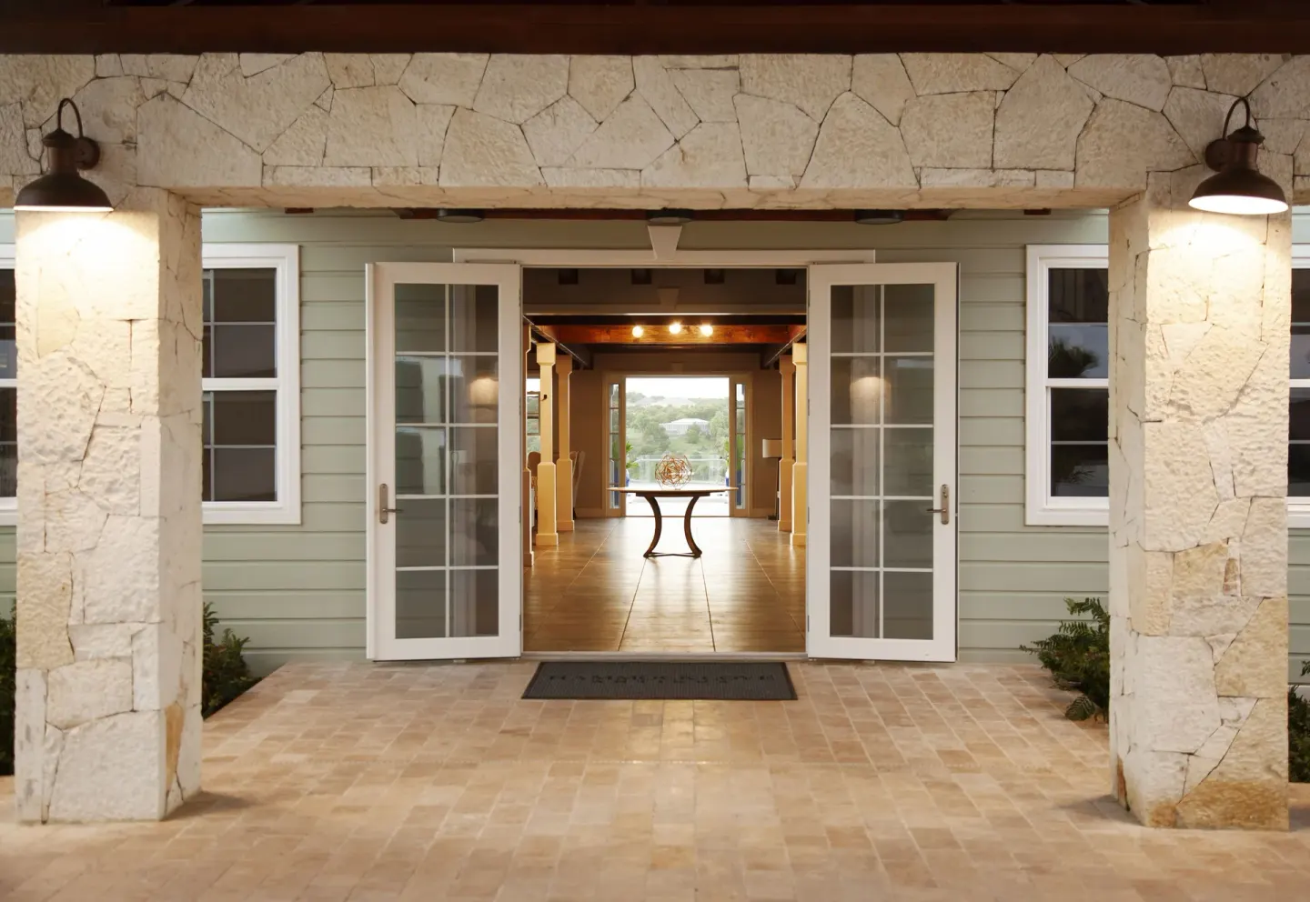 Open French doors lead into the lobby entrance at Hammock Cove Antigua.