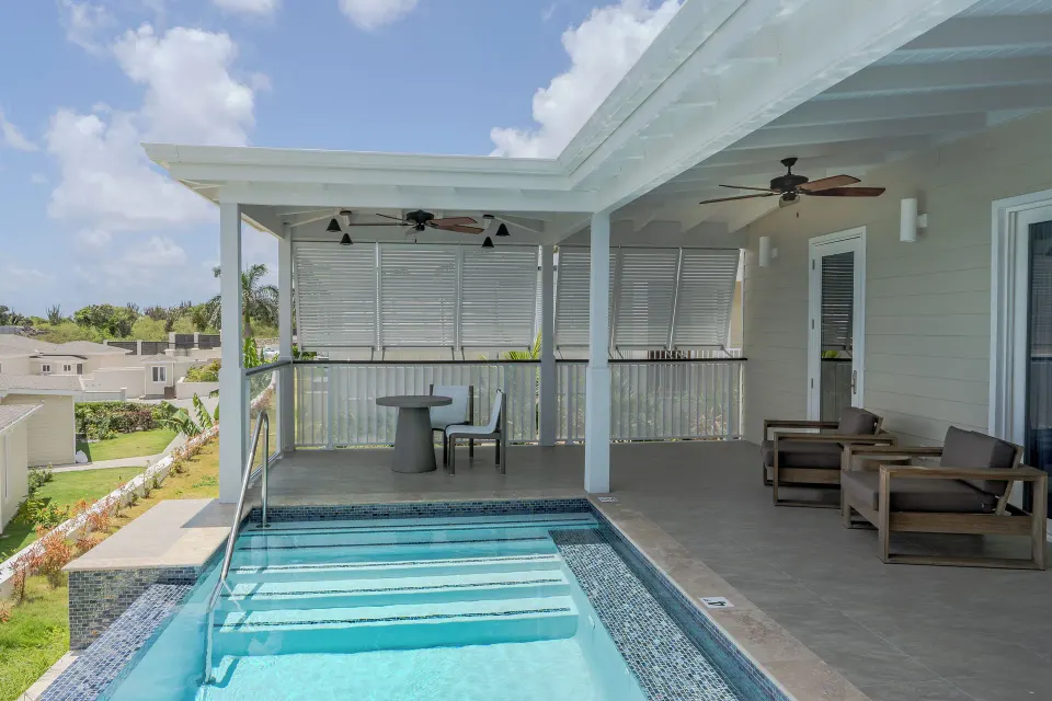 Signature Villa terrace with plunge pool, seating, and privacy shutters at Hammock Cove Antigua.