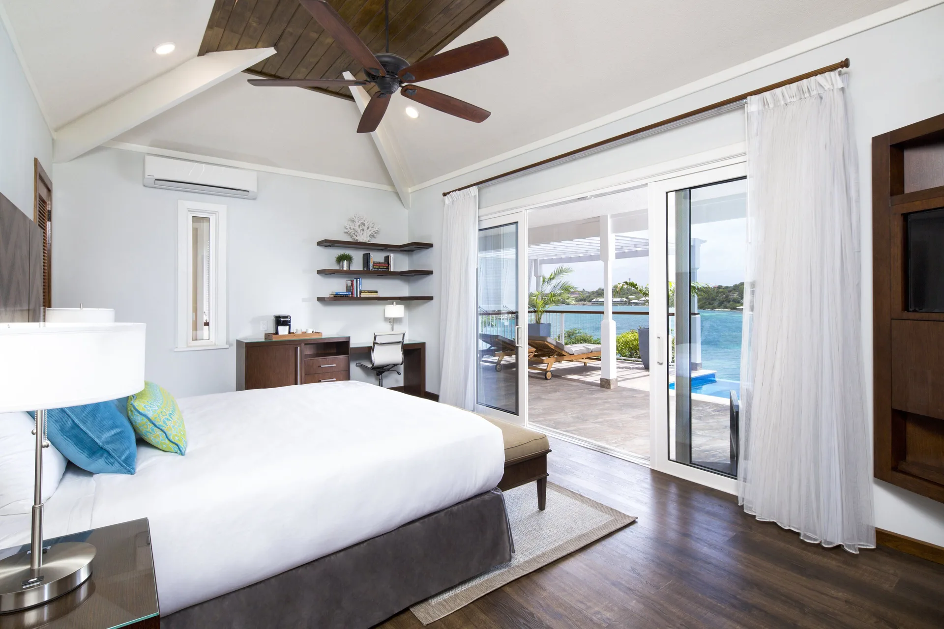 Waterfront Villa bedroom with king bed and terrace view at Hammock Cove Antigua.