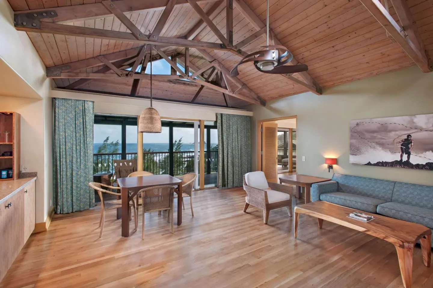Oceanfront bungalow living area with vaulted wood ceiling at Hana-Maui Resort.