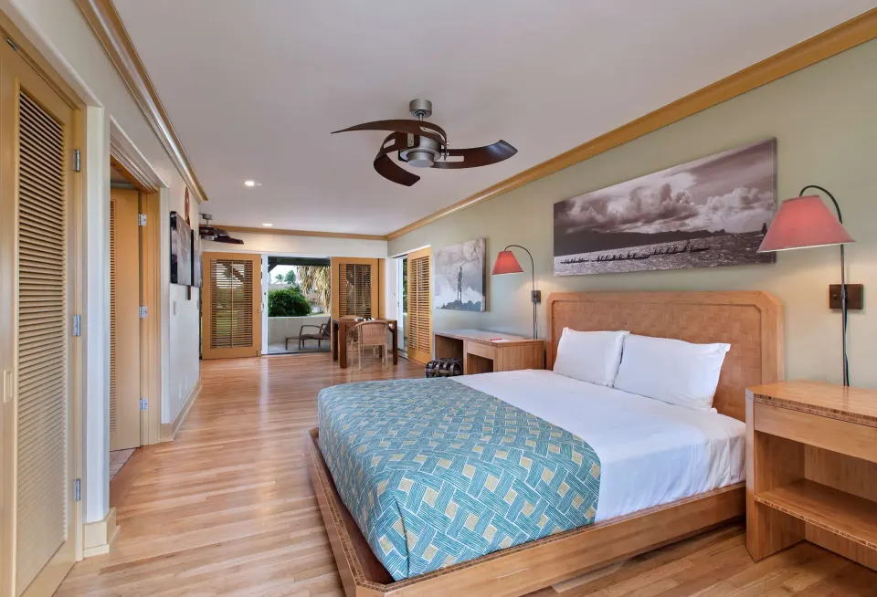 Room Garden View with one bed and wood shutters at Hana-Maui Resort.