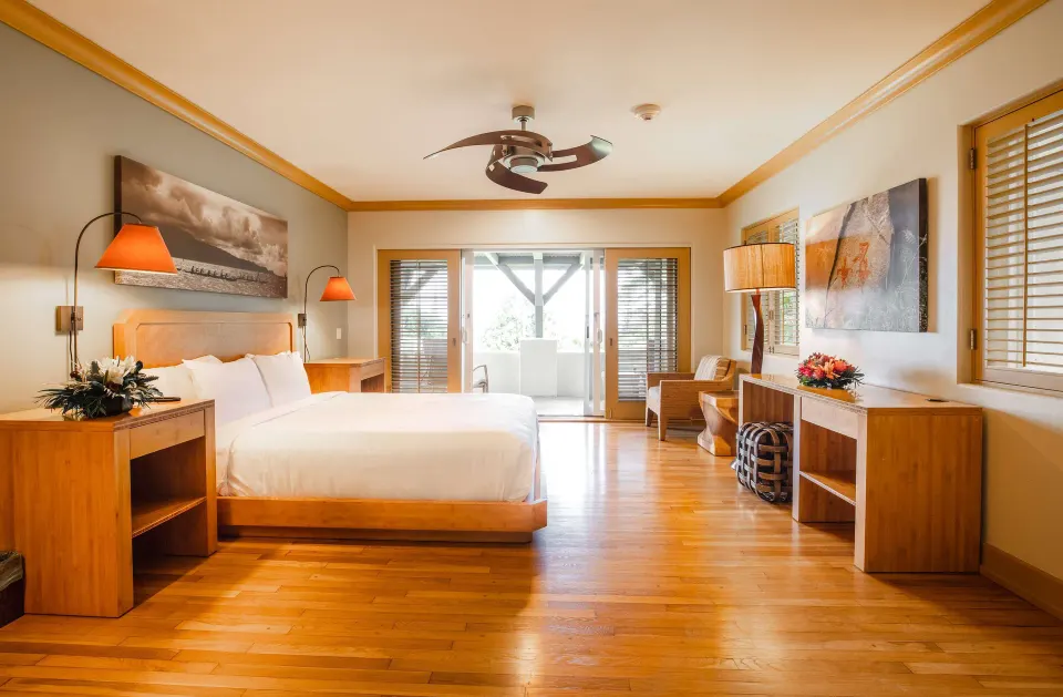 Studio Partial Ocean View room with king bed and lanai doors at Hana-Maui Resort.